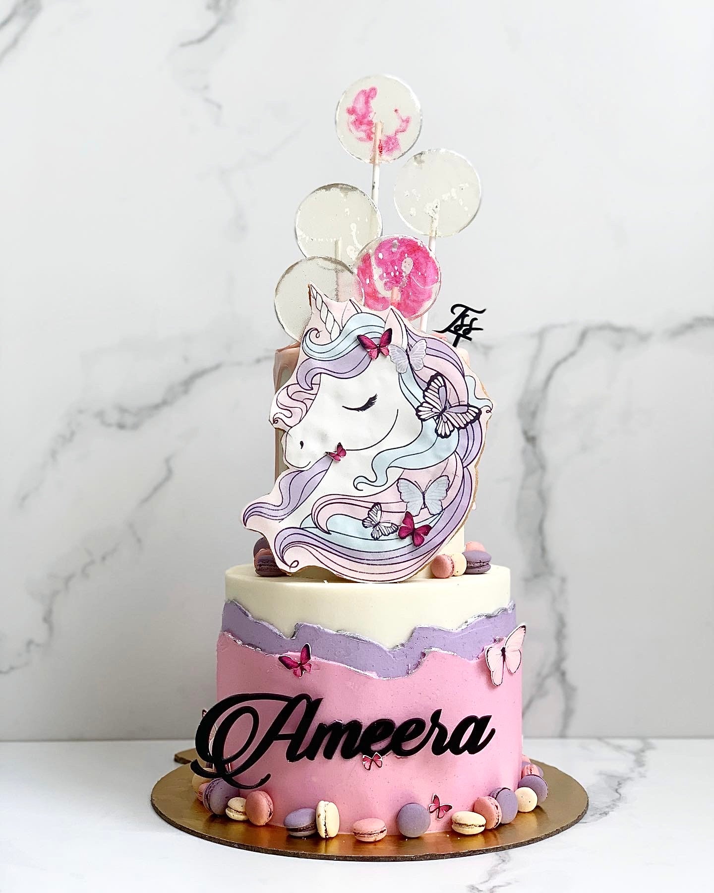 Colorful tiered kids cake from The Sinful Spoon with vibrant frosting and playful decorations, perfect for children's celebrations.