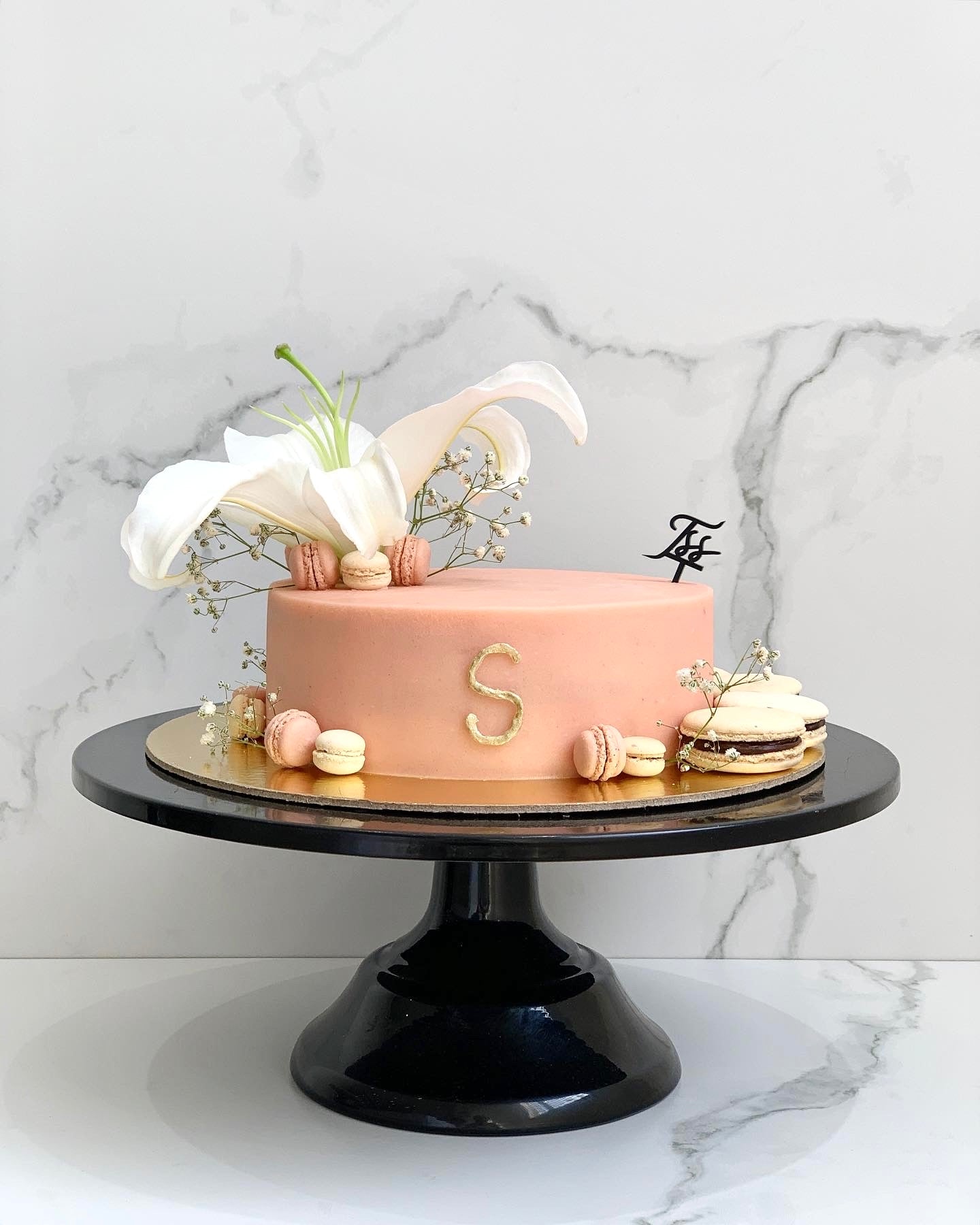 Fresh floral cakes by The Sinful Spoon featuring colorful, decorative icing with fresh edible flowers and intricate cake designs.