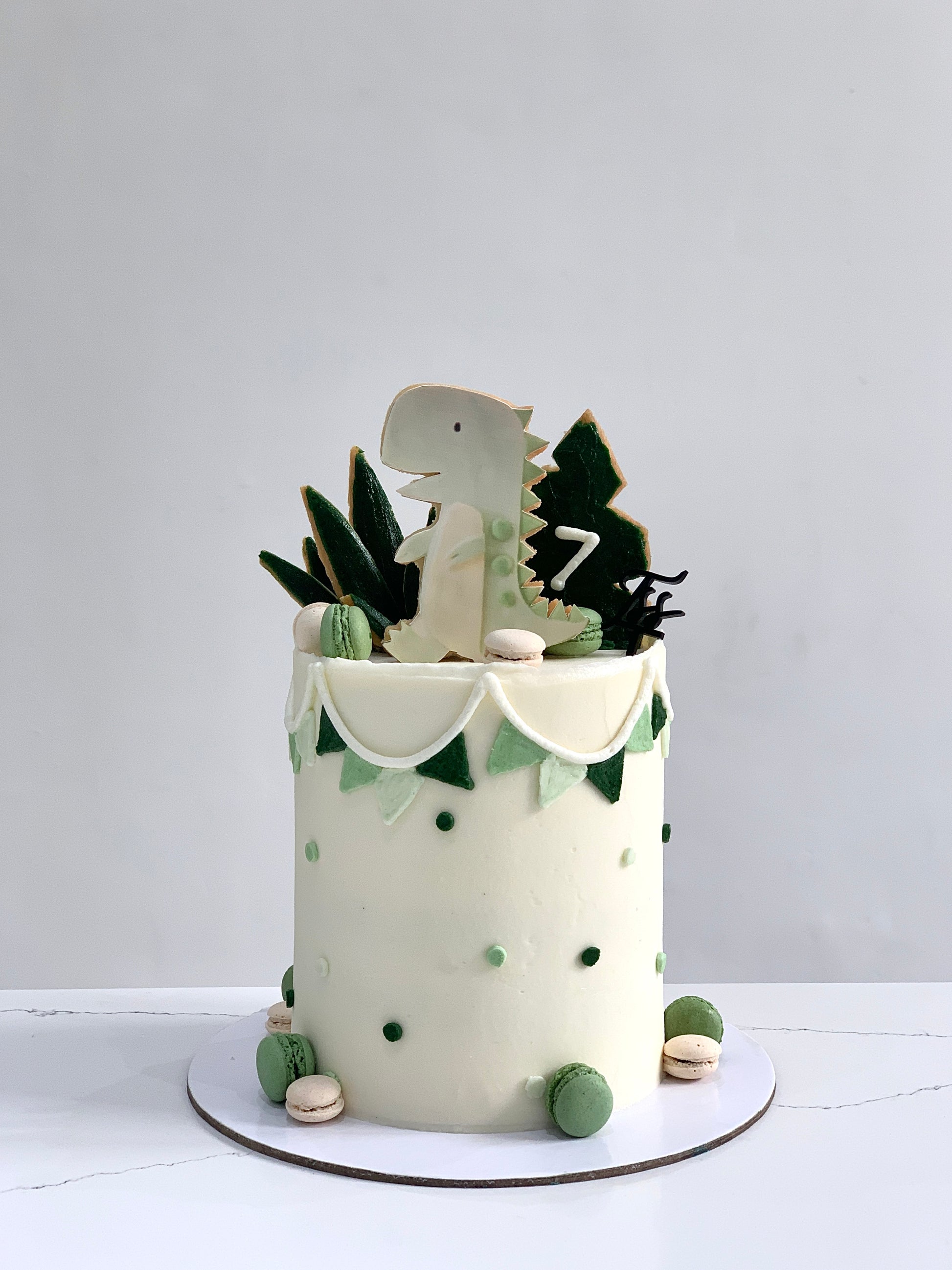 Decorative edible paper cake topper featuring a baby boy design from The Sinful Spoon, perfect for baby shower cakes.