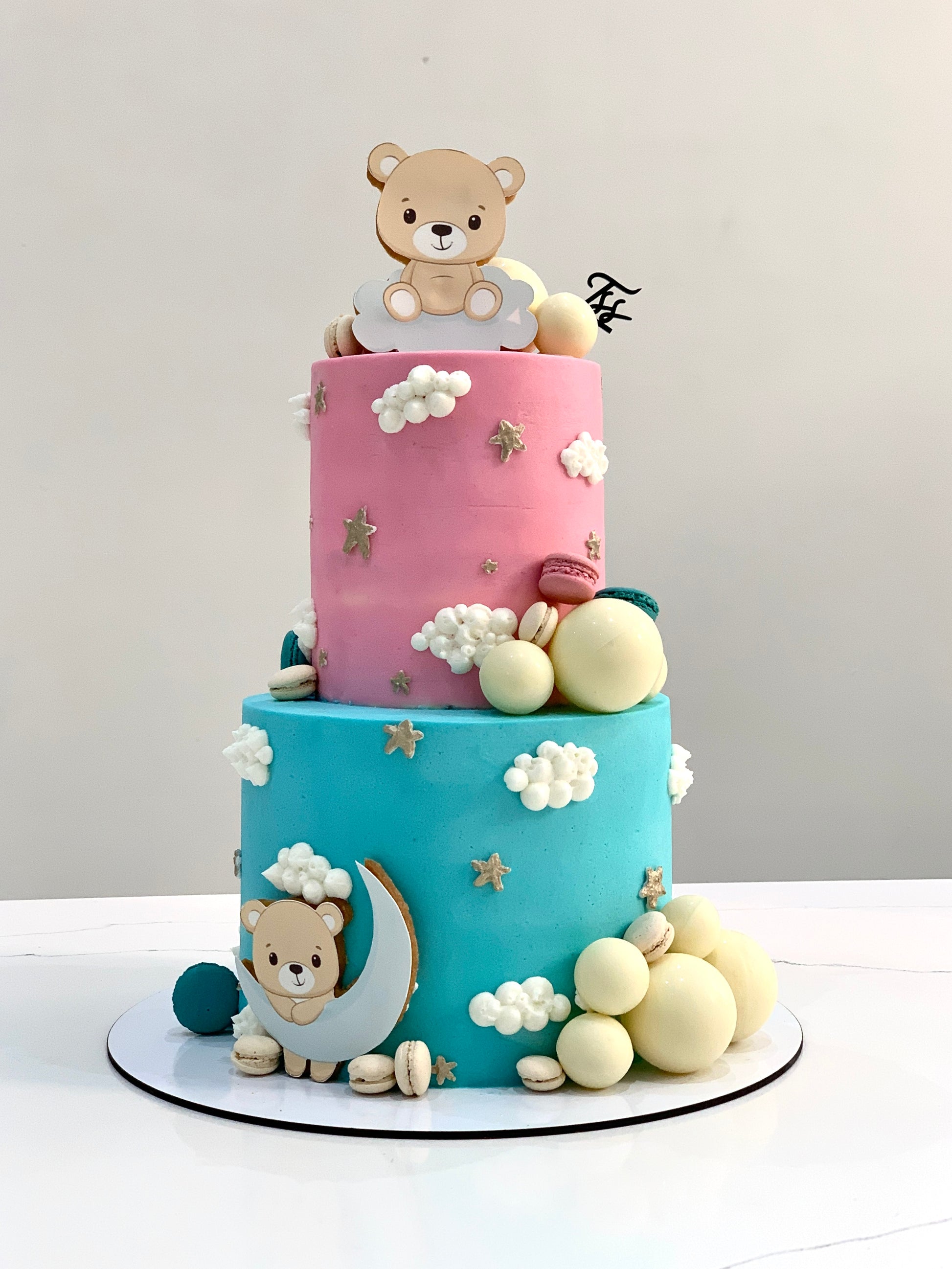 Colorful tiered kids cake from The Sinful Spoon with playful decorations and multiple cake layers for children's celebrations.