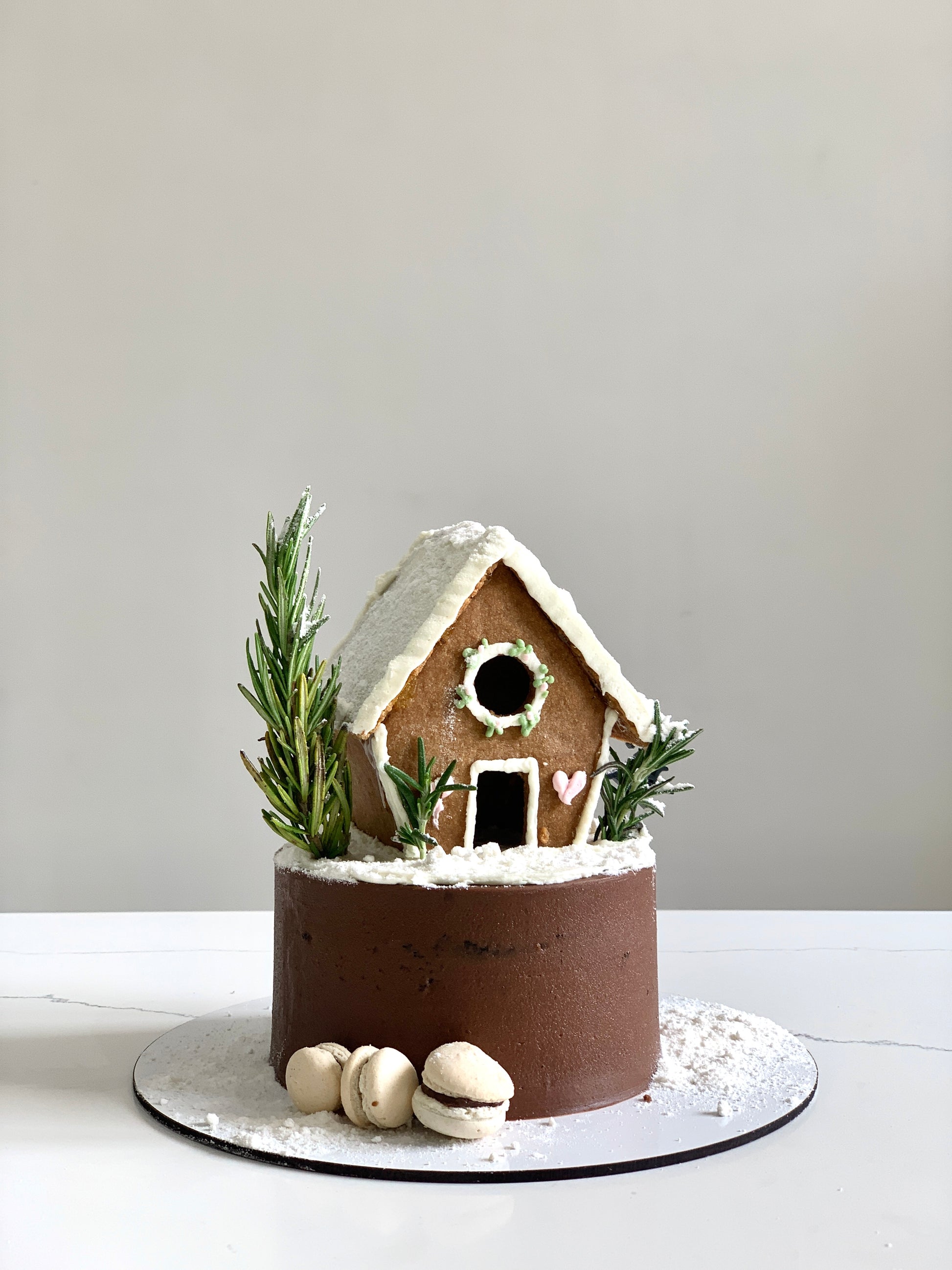 Decorative Christmas cake from The Sinful Spoon with festive icing and holiday-themed decorations.