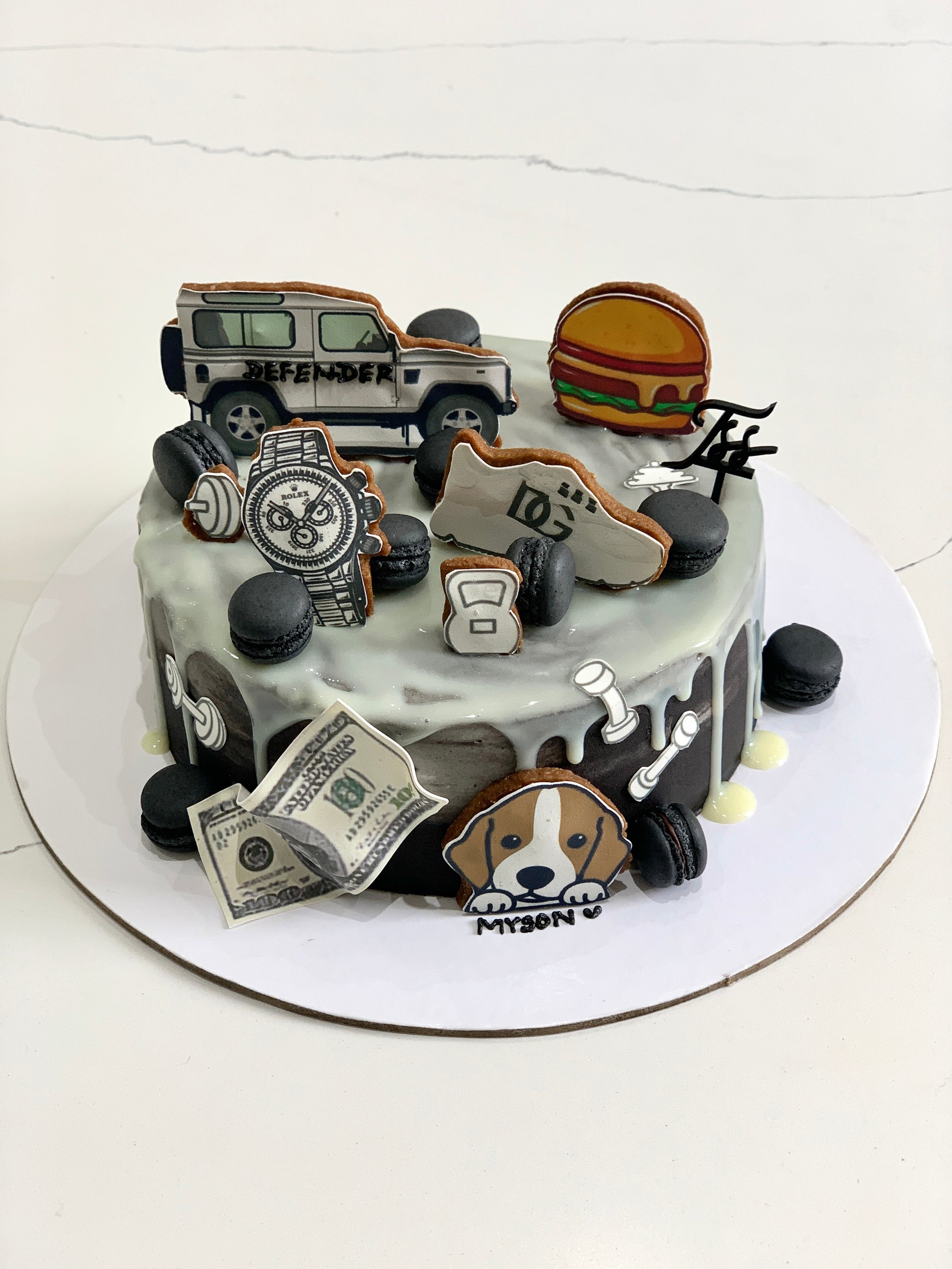 Decorative edible paper cakes from The Sinful Spoon, showcasing colorful layered cakes with detailed frosting and edible decorations.