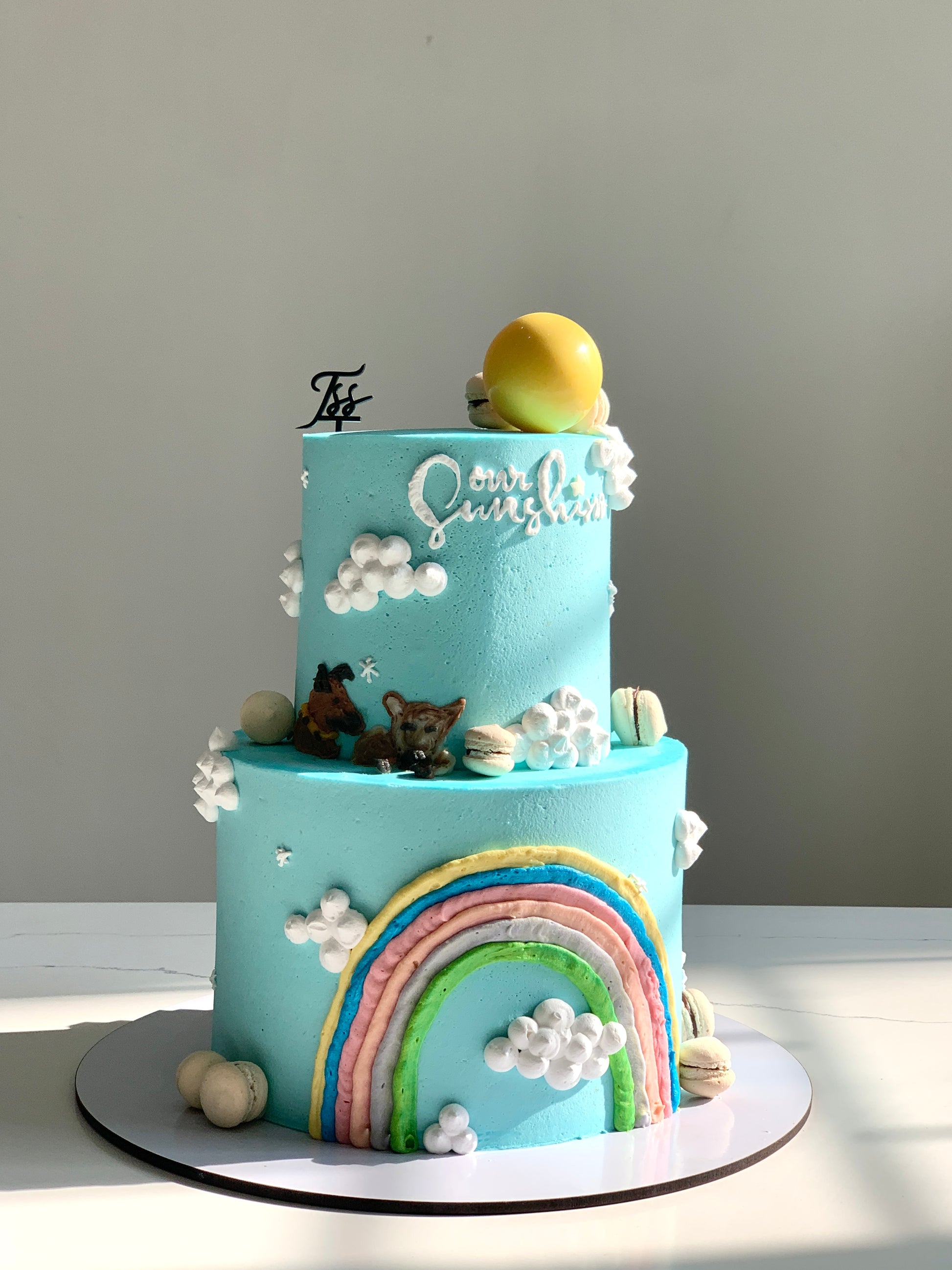 Colorful tiered kids cake from The Sinful Spoon with vibrant frosting and playful design, perfect for children's celebrations.