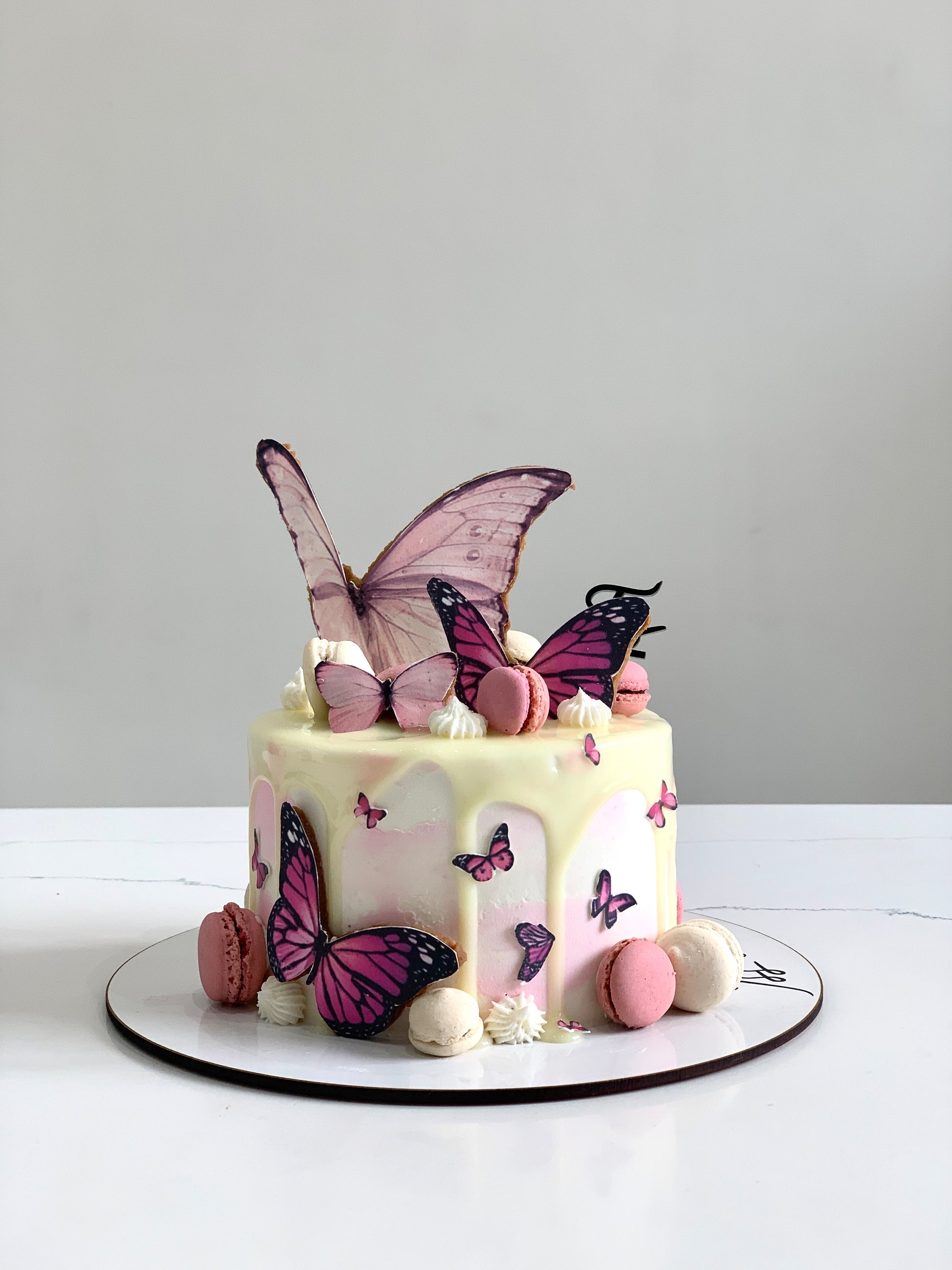 Edible paper cake topper featuring a baby girl design from The Sinful Spoon, suitable for baby shower cakes.