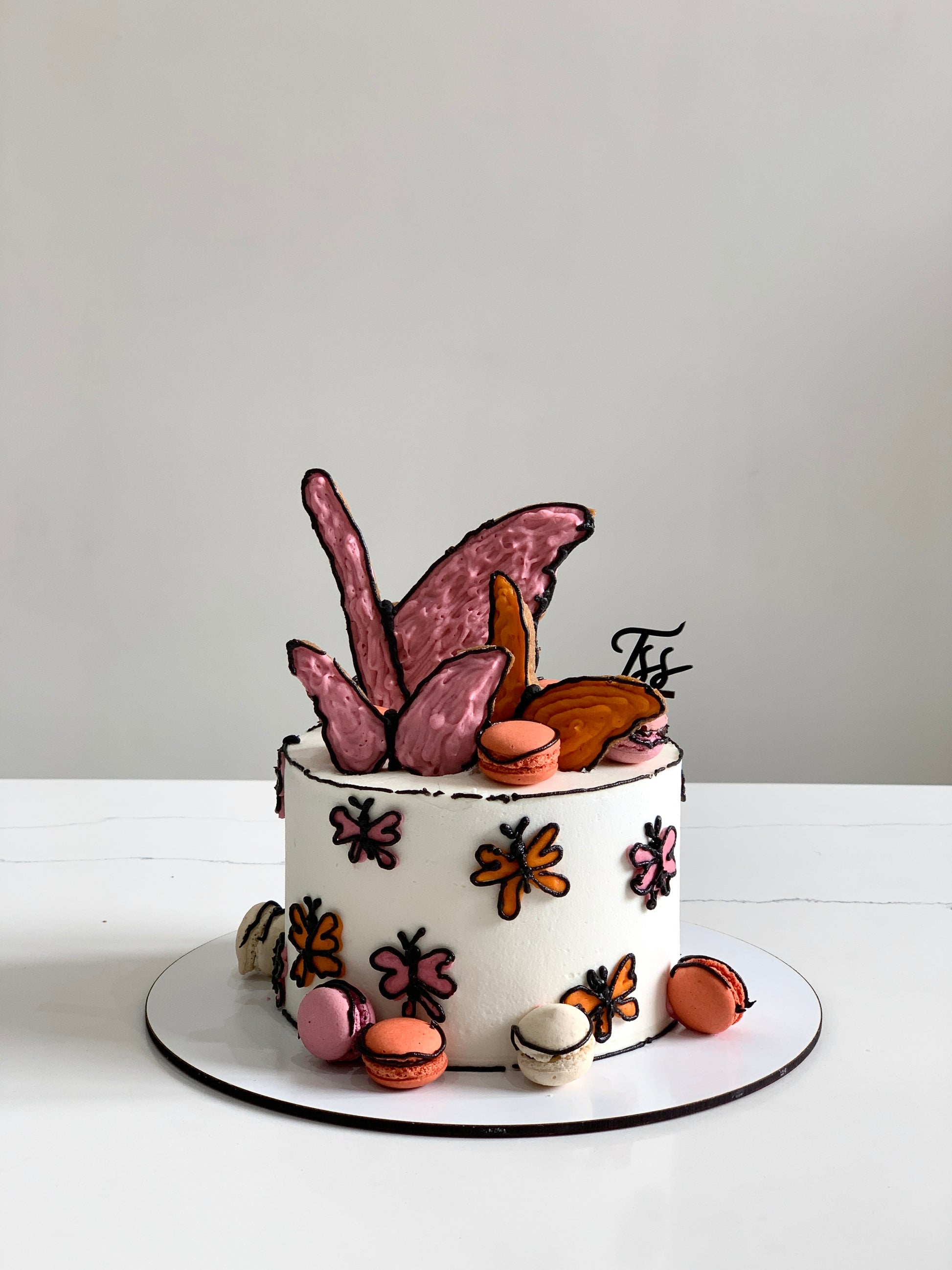 Colorful comic-themed cakes by The Sinful Spoon with vibrant icing and playful designs perfect for celebrations.