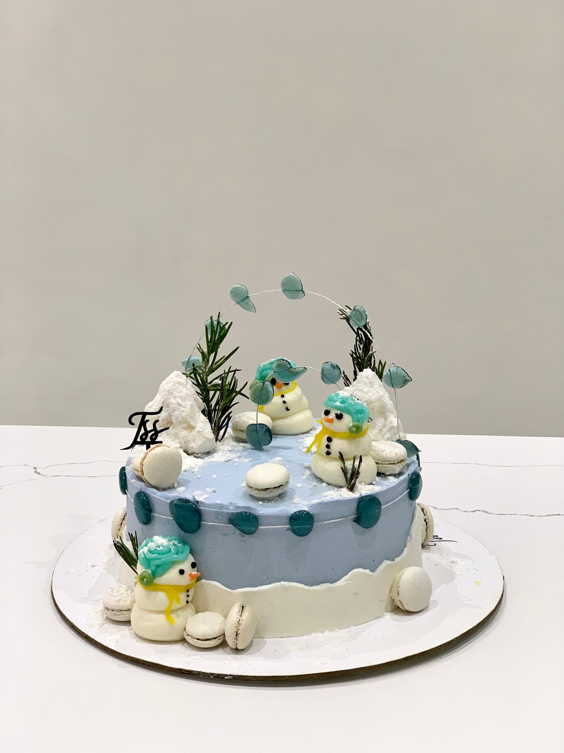 Decorative Christmas cake from The Sinful Spoon featuring festive icing and holiday-themed decorations, perfect for holiday celebrations.