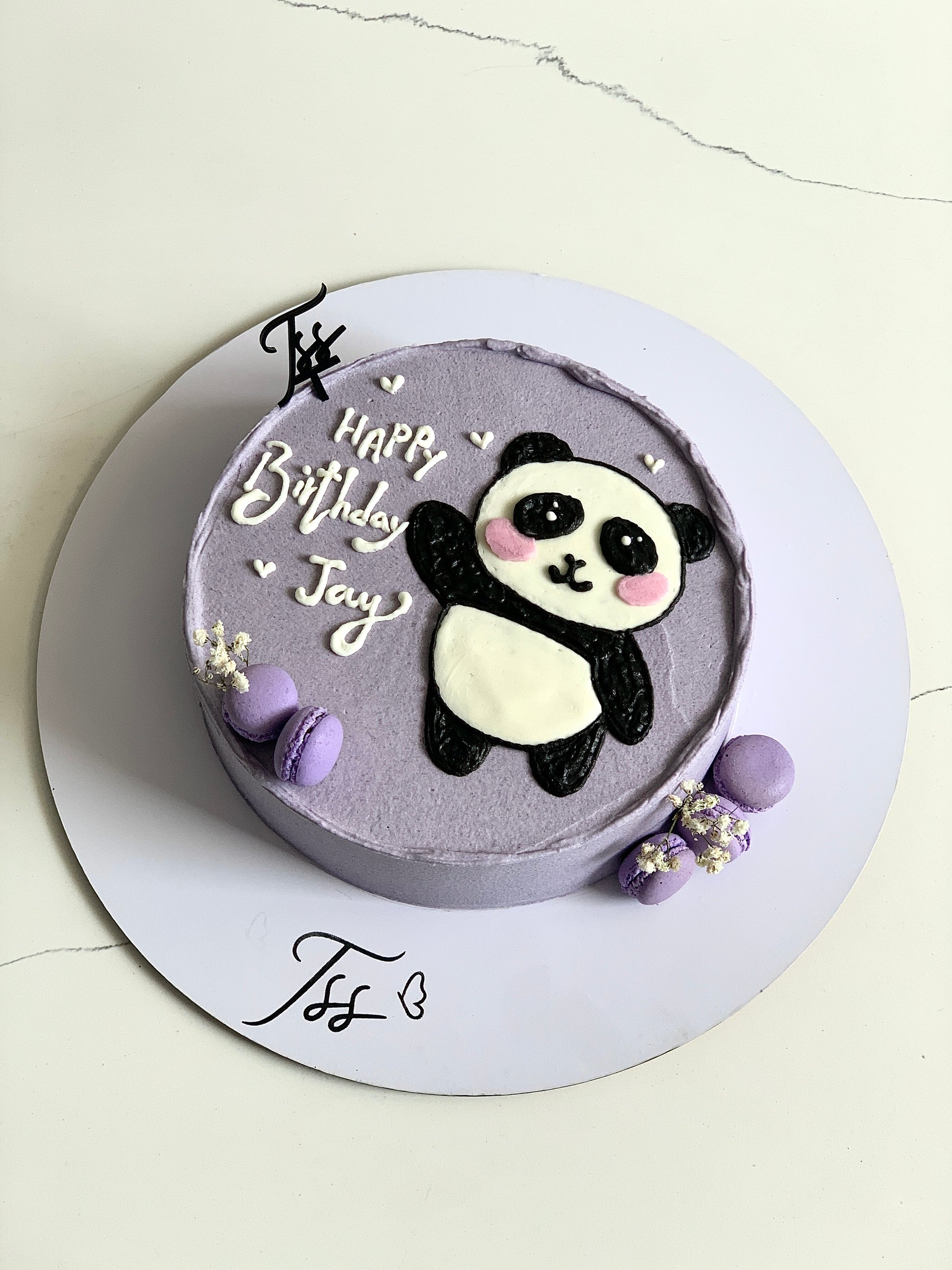 Decorative buttercream illustration cake by The Sinful Spoon featuring colorful, detailed piping and artistic floral designs.