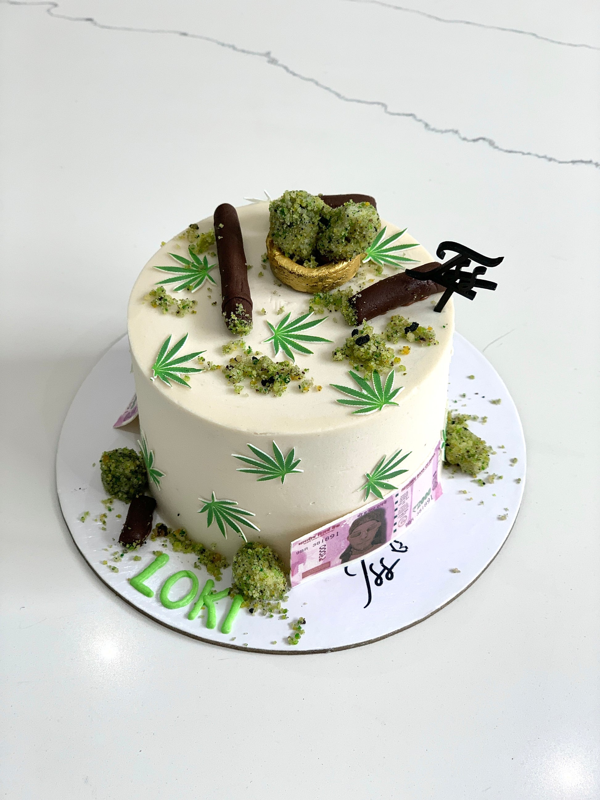 Edible paper cakes from The Sinful Spoon featuring colorful, decorative cake designs on a white background.
