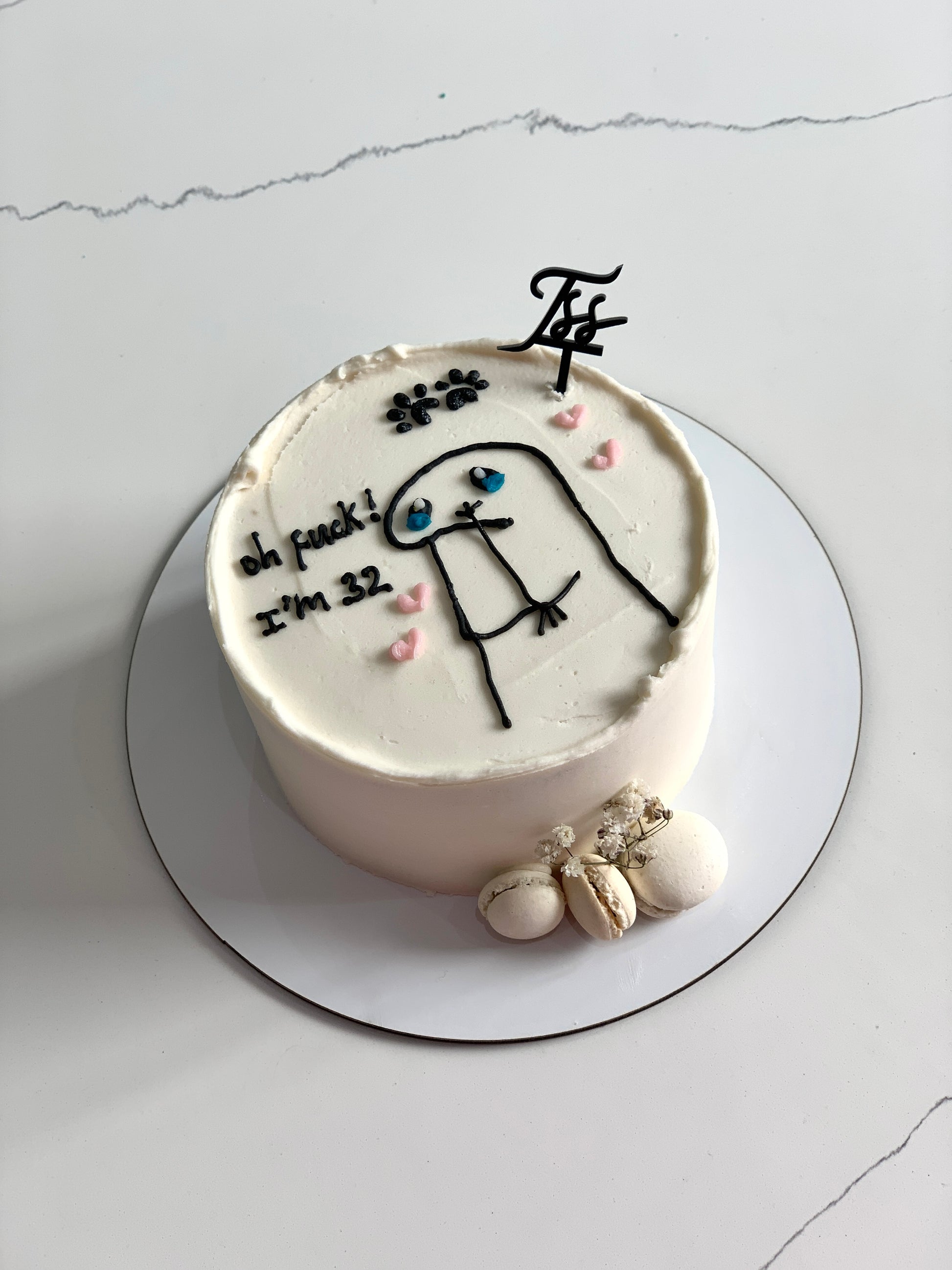 Colorful buttercream illustration cake from The Sinful Spoon featuring vibrant, detailed piping and decorative cake art.