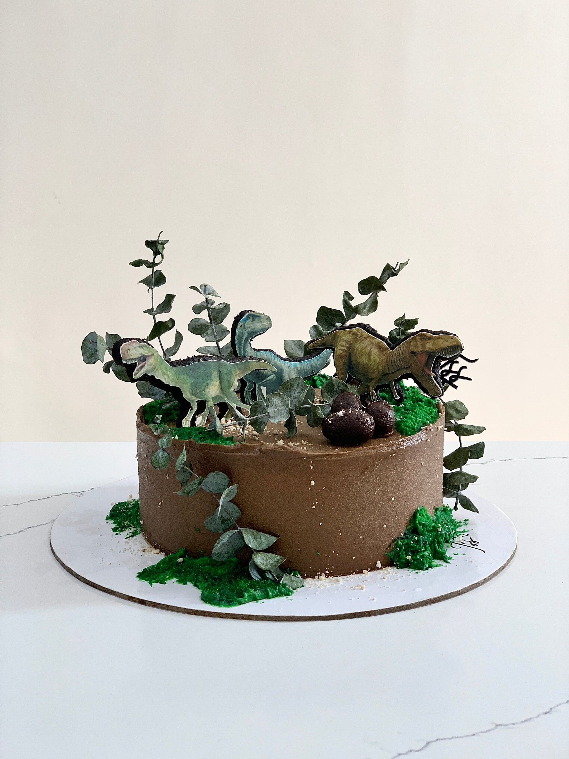 Edible paper cake decorated for a baby boy celebration, featuring blue and white themed designs by The Sinful Spoon.