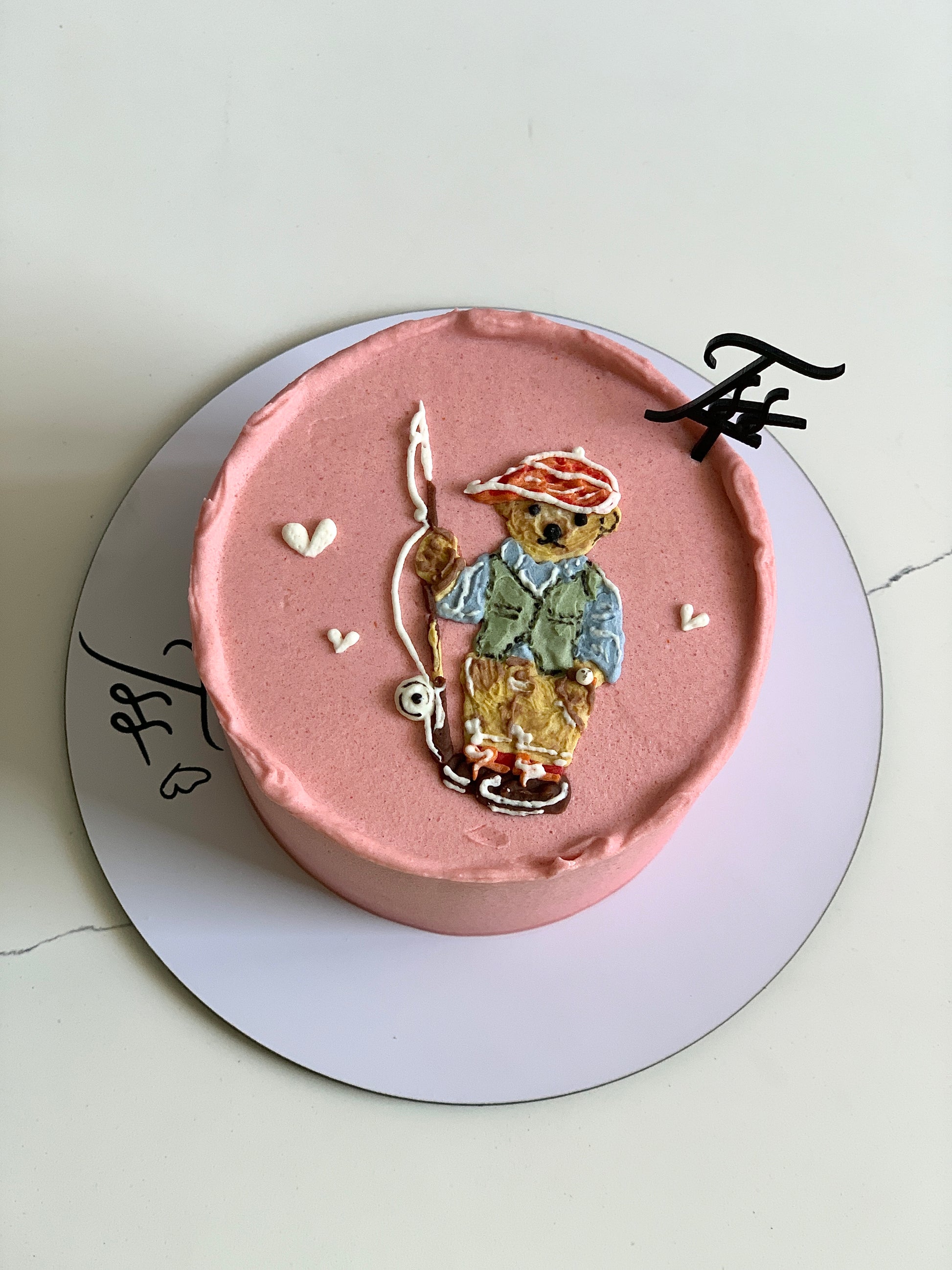 Decorative buttercream illustration cake by The Sinful Spoon featuring colorful floral and artistic piping details.