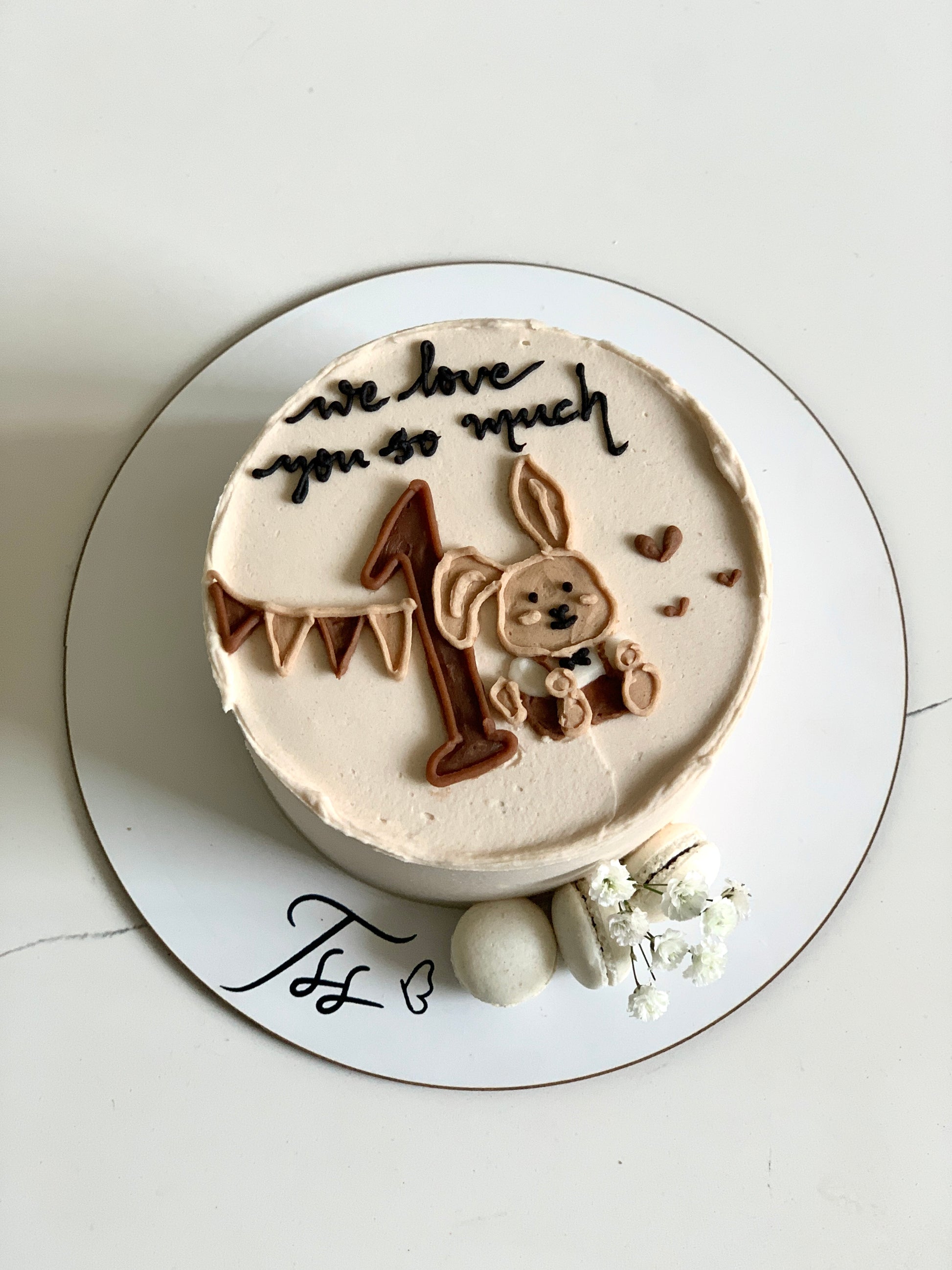 Buttercream illustration cake by The Sinful Spoon with colorful floral and artistic decorative piping on a round cake.