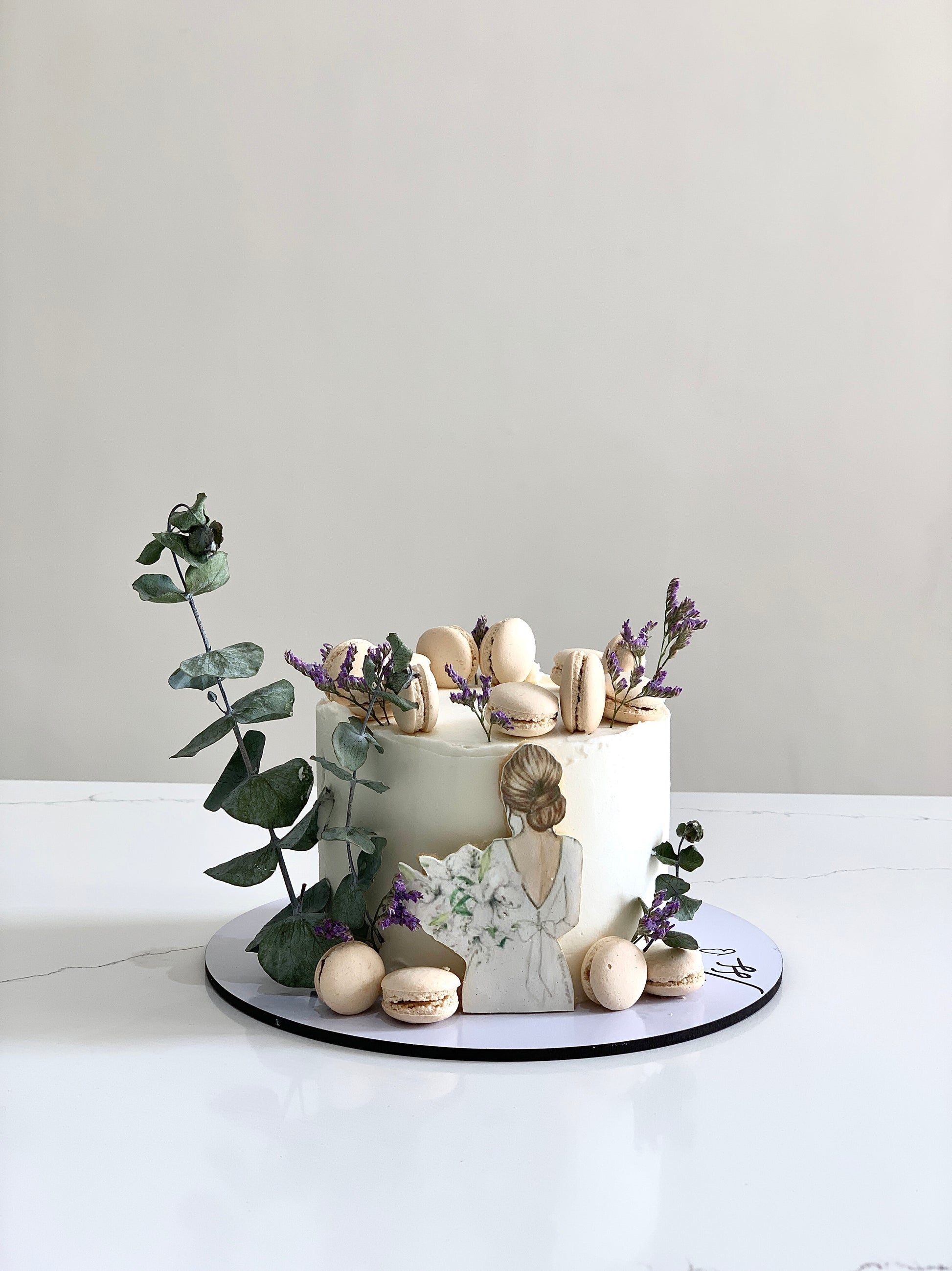 Edible paper cake decoration from The Sinful Spoon, featuring colorful, detailed edible artwork on a white background.