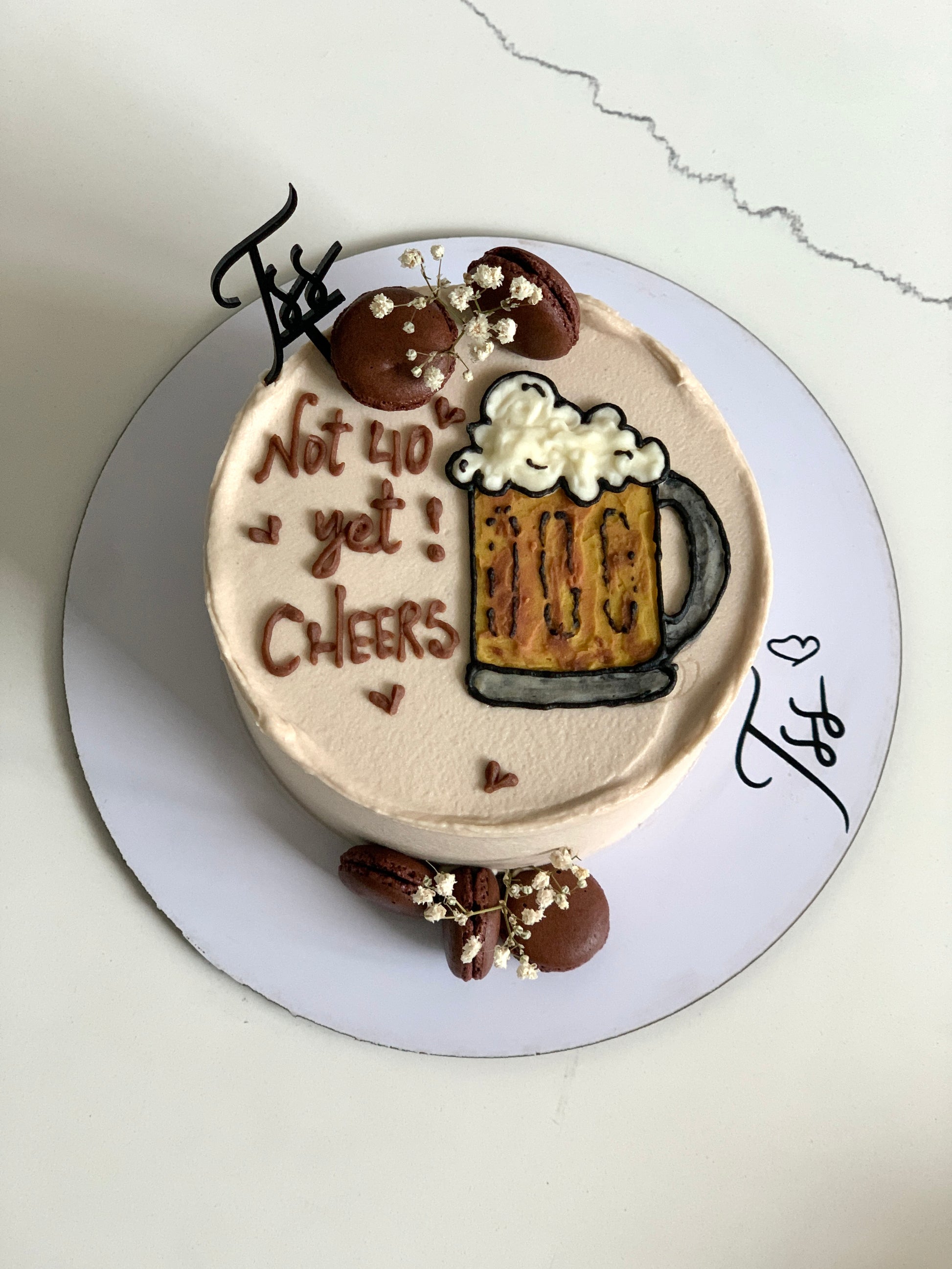 Decorative buttercream illustration cake by The Sinful Spoon featuring colorful floral and artistic piping details.