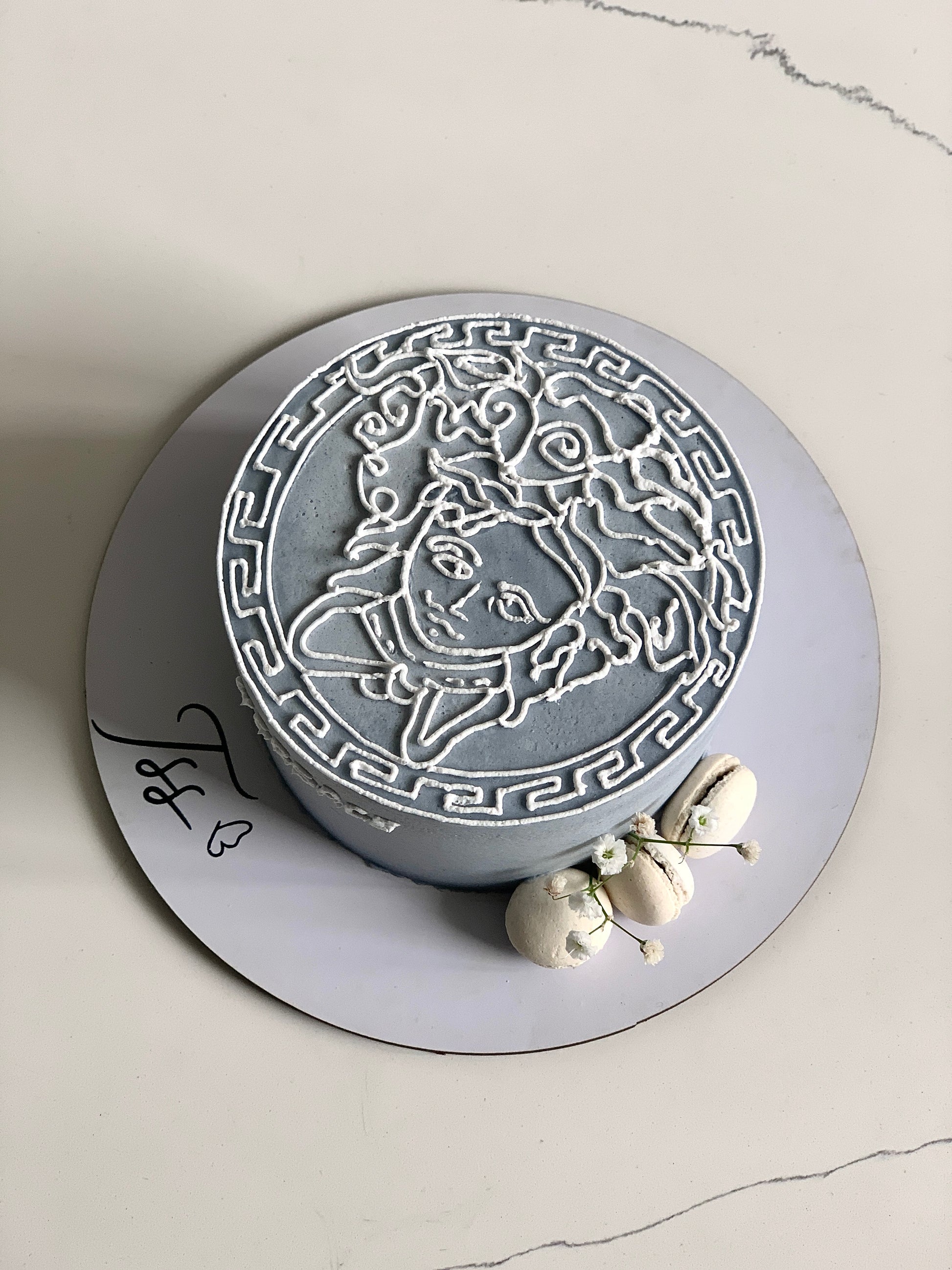 Buttercream illustration cake by The Sinful Spoon with colorful floral and whimsical design, detailed piping and decorative accents.
