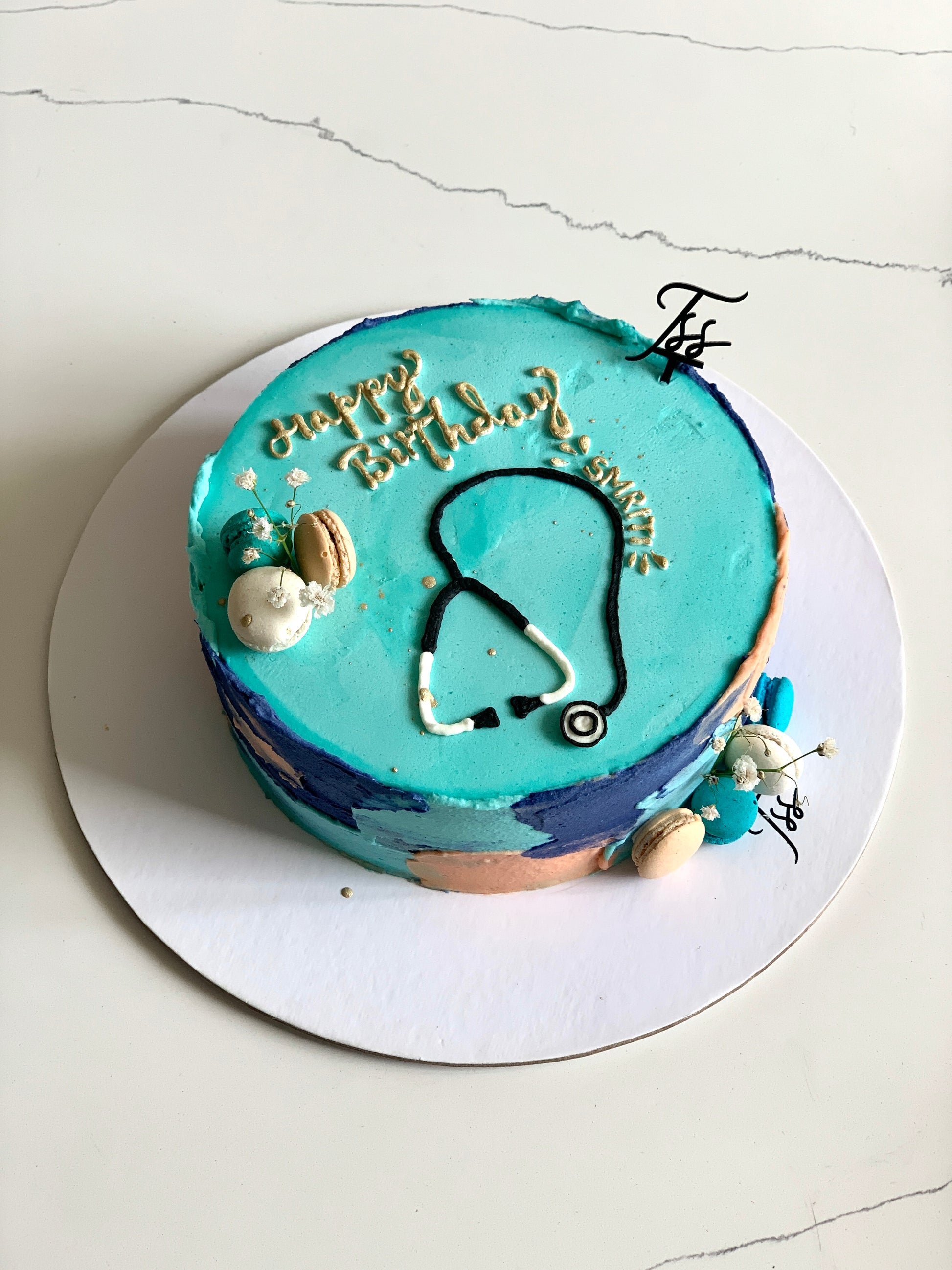 Colorful buttercream illustration cake with floral and whimsical designs from The Sinful Spoon, decorated with vibrant buttercream art.