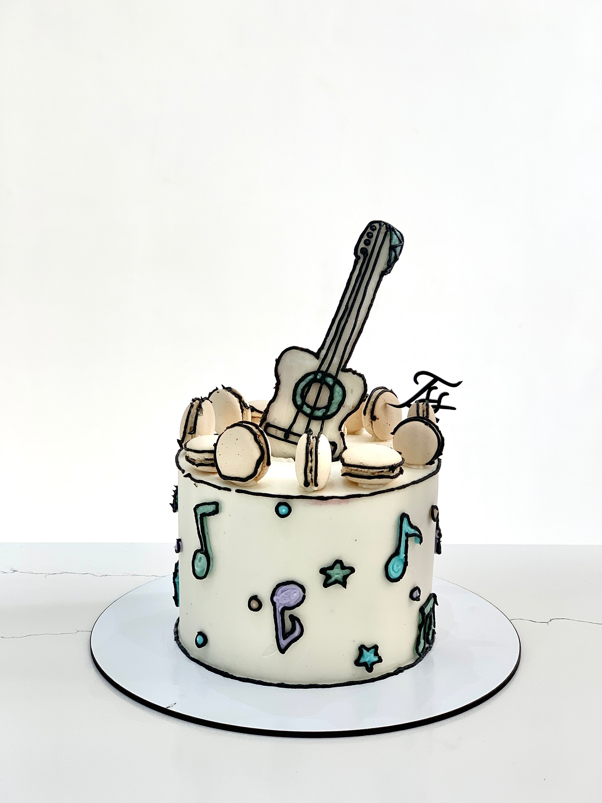 Colorful comic cake from The Sinful Spoon with vibrant frosting and detailed superhero-themed decorations.
