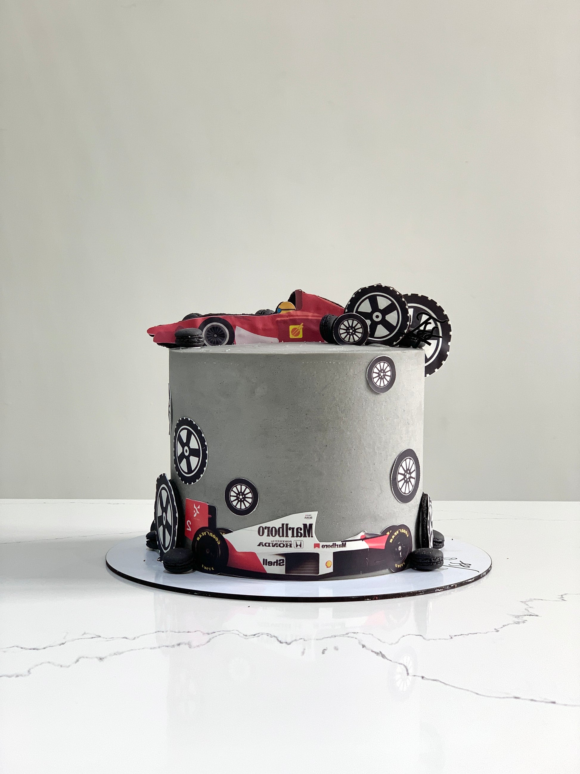Edible paper cake with baby boy theme from The Sinful Spoon, featuring colorful decorations and intricate edible details.