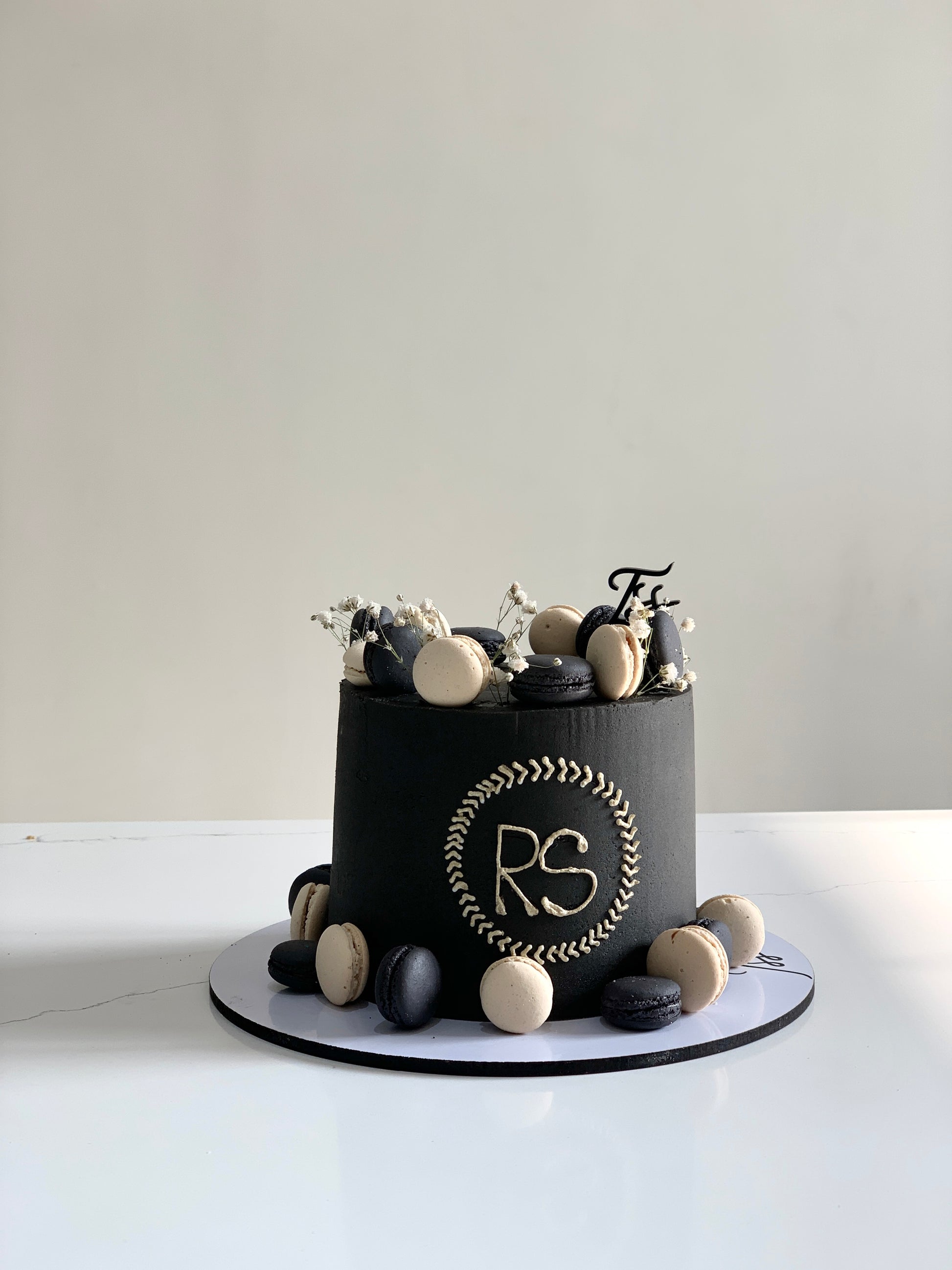 Classic cakes from The Sinful Spoon featuring layered sponge cakes with frosting and decorative toppings.