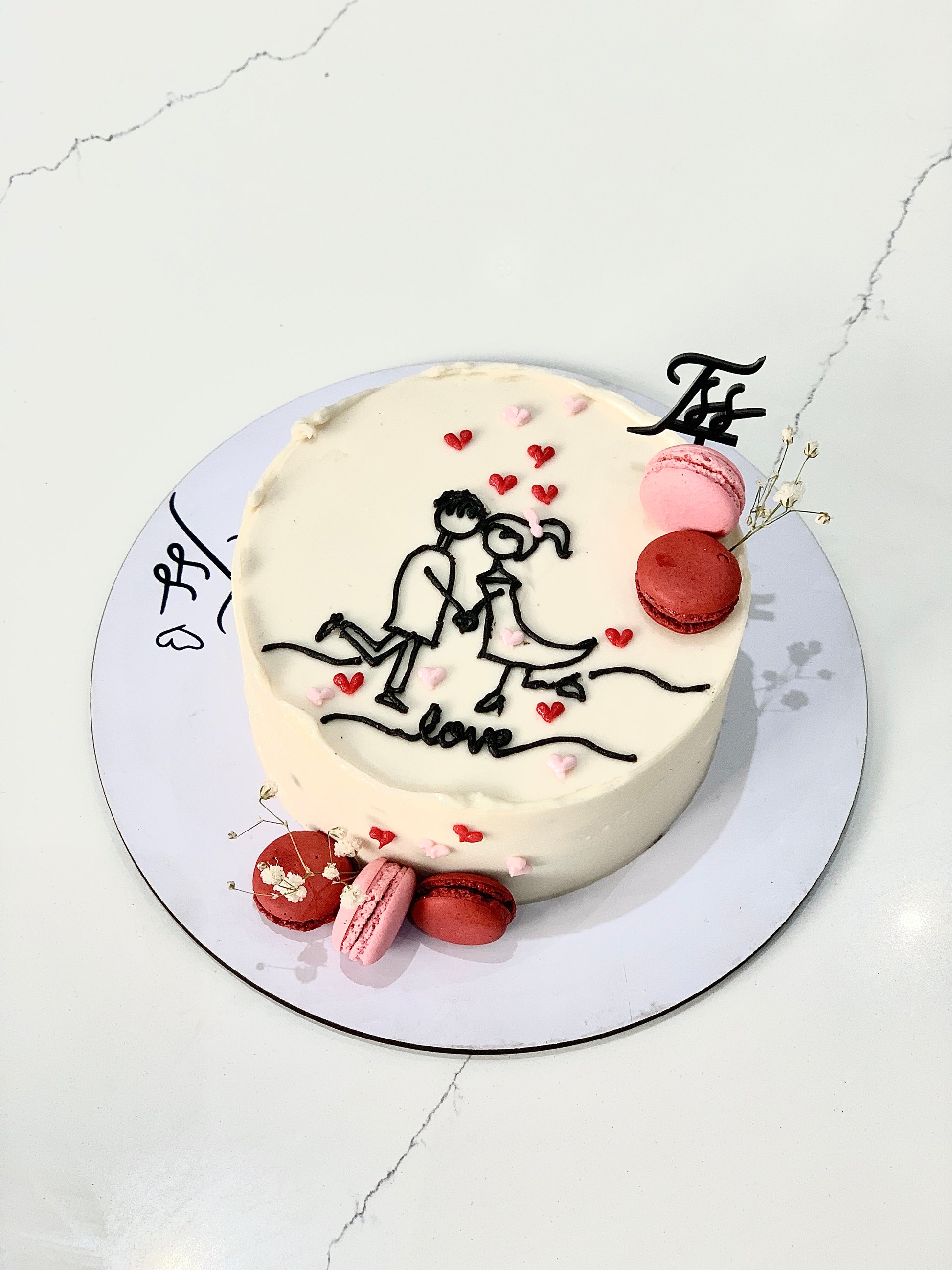 Valentine's Day cakes from The Sinful Spoon featuring heart-shaped decorations and rich frosting for romantic celebrations.