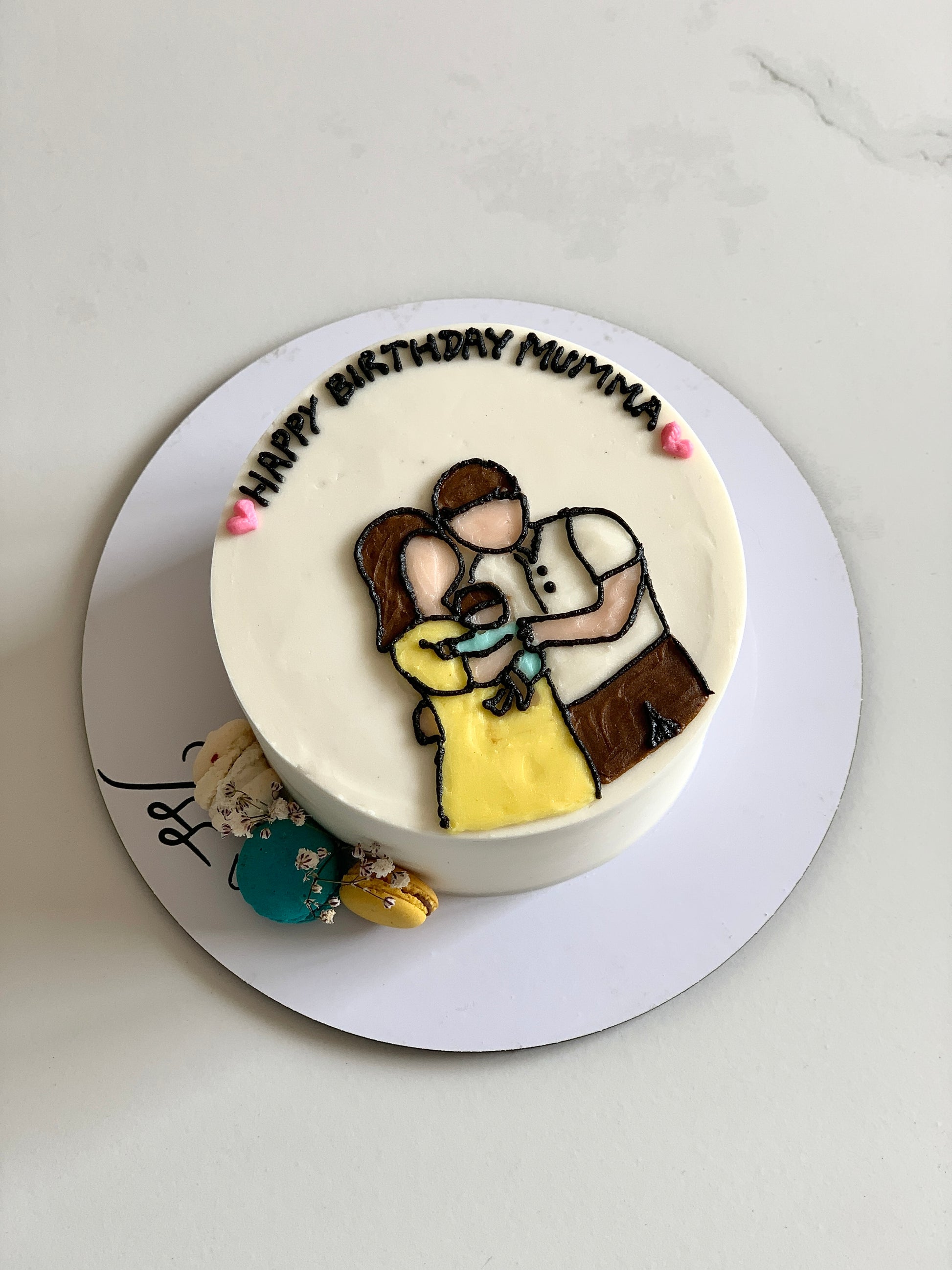 Decorative baby shower cake with pastel colors and themed toppers, created by The Sinful Spoon for celebrating new arrivals.