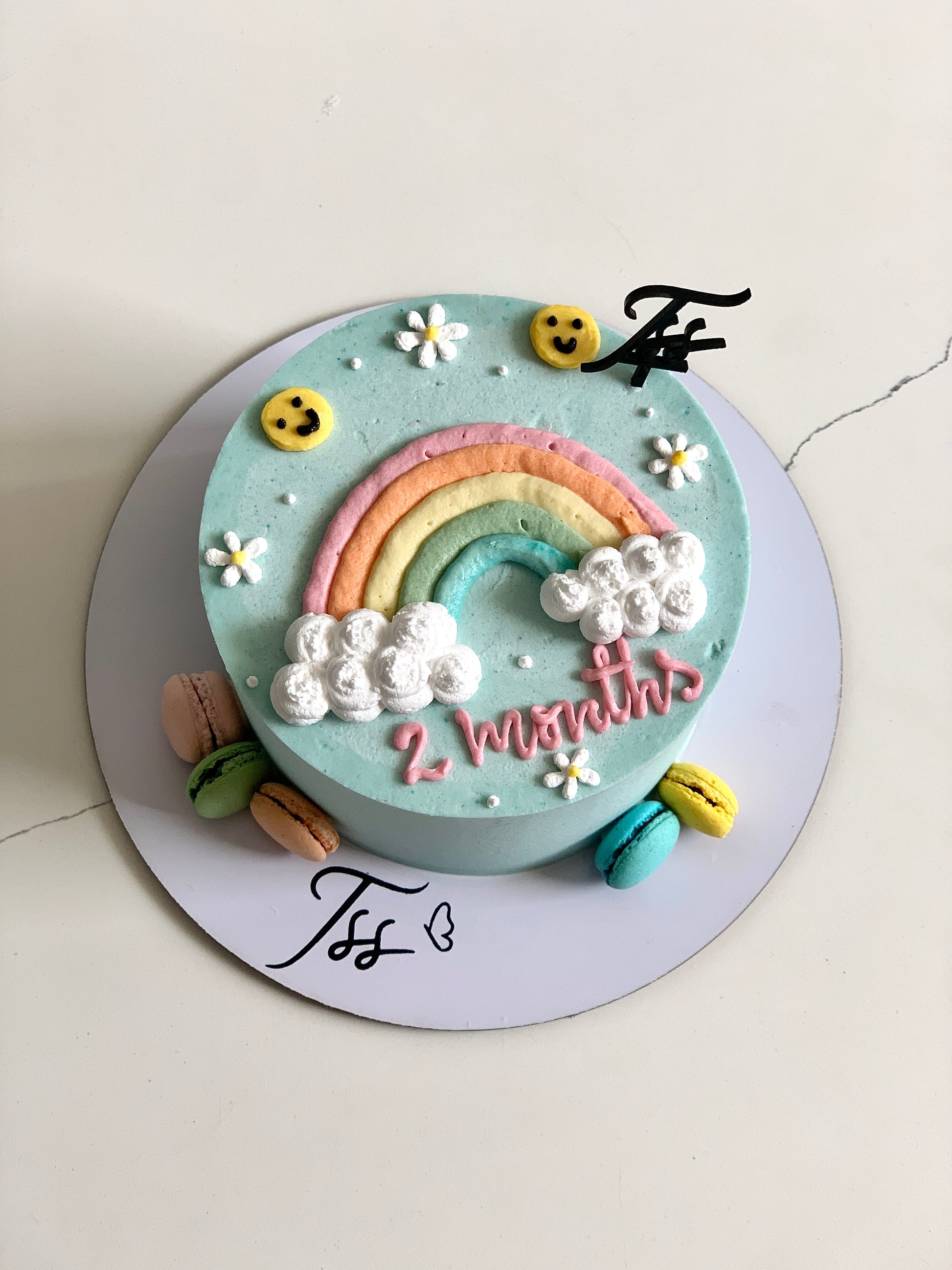 Colorful buttercream illustration cake by The Sinful Spoon featuring intricate floral and whimsical design details.