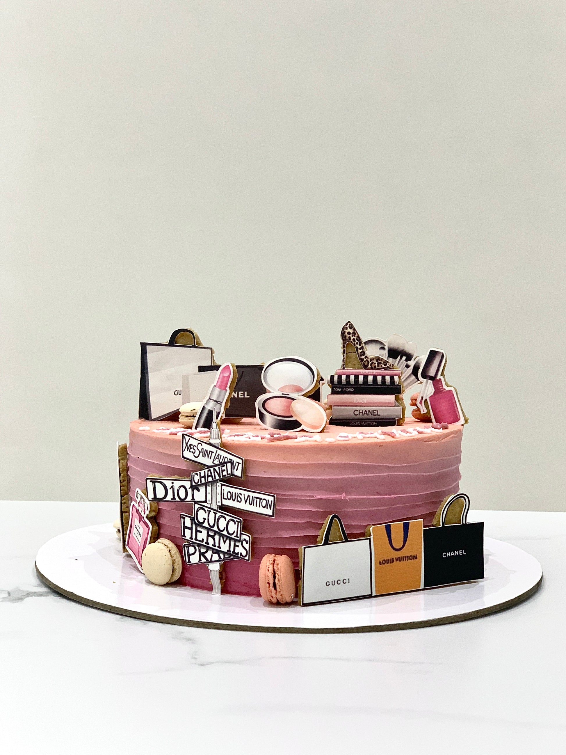Decorative Mother's Day cake from The Sinful Spoon with floral icing and festive design, perfect for celebrating moms.