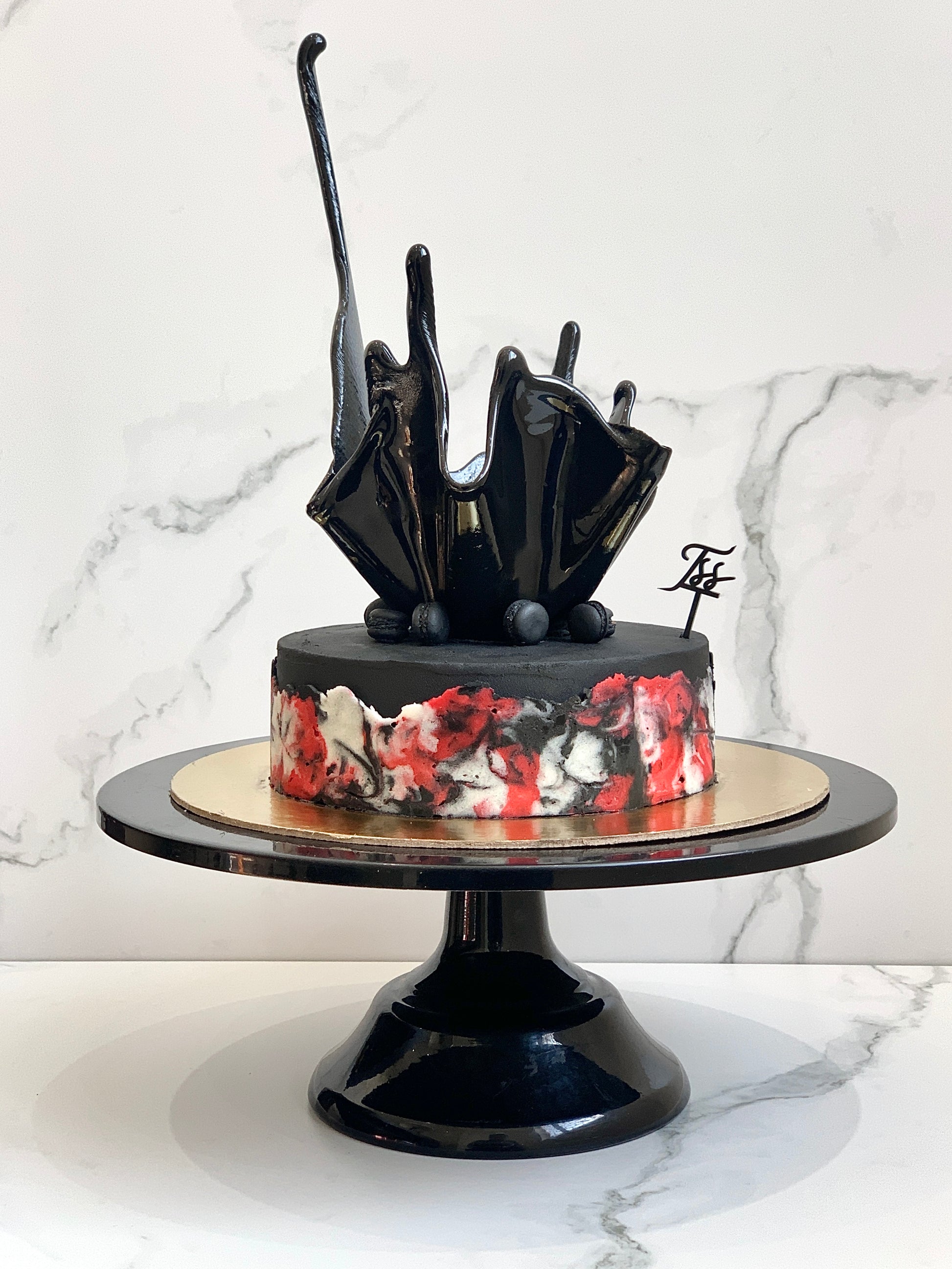 Isomalt sugar cakes by The Sinful Spoon, showing shiny, amber-colored candies with smooth, glossy surfaces for decorative baking.