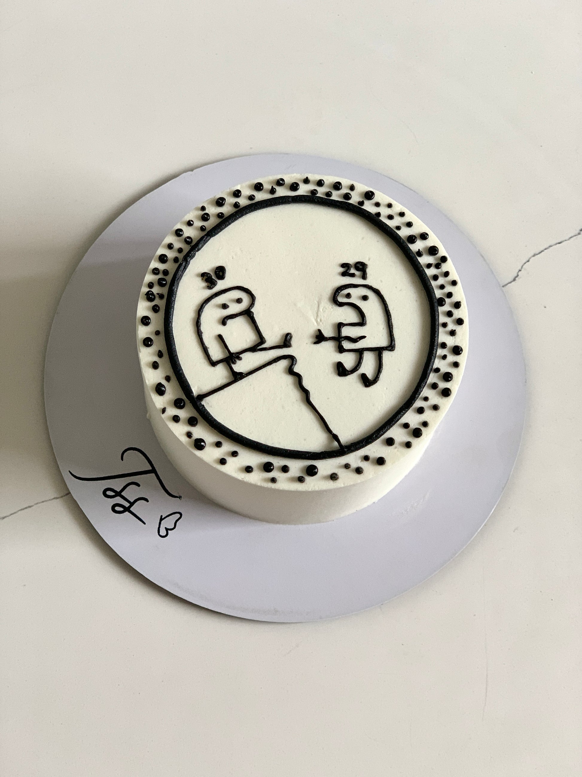 Buttercream illustration cake by The Sinful Spoon featuring colorful, detailed decorative cake art with smooth buttercream finish.