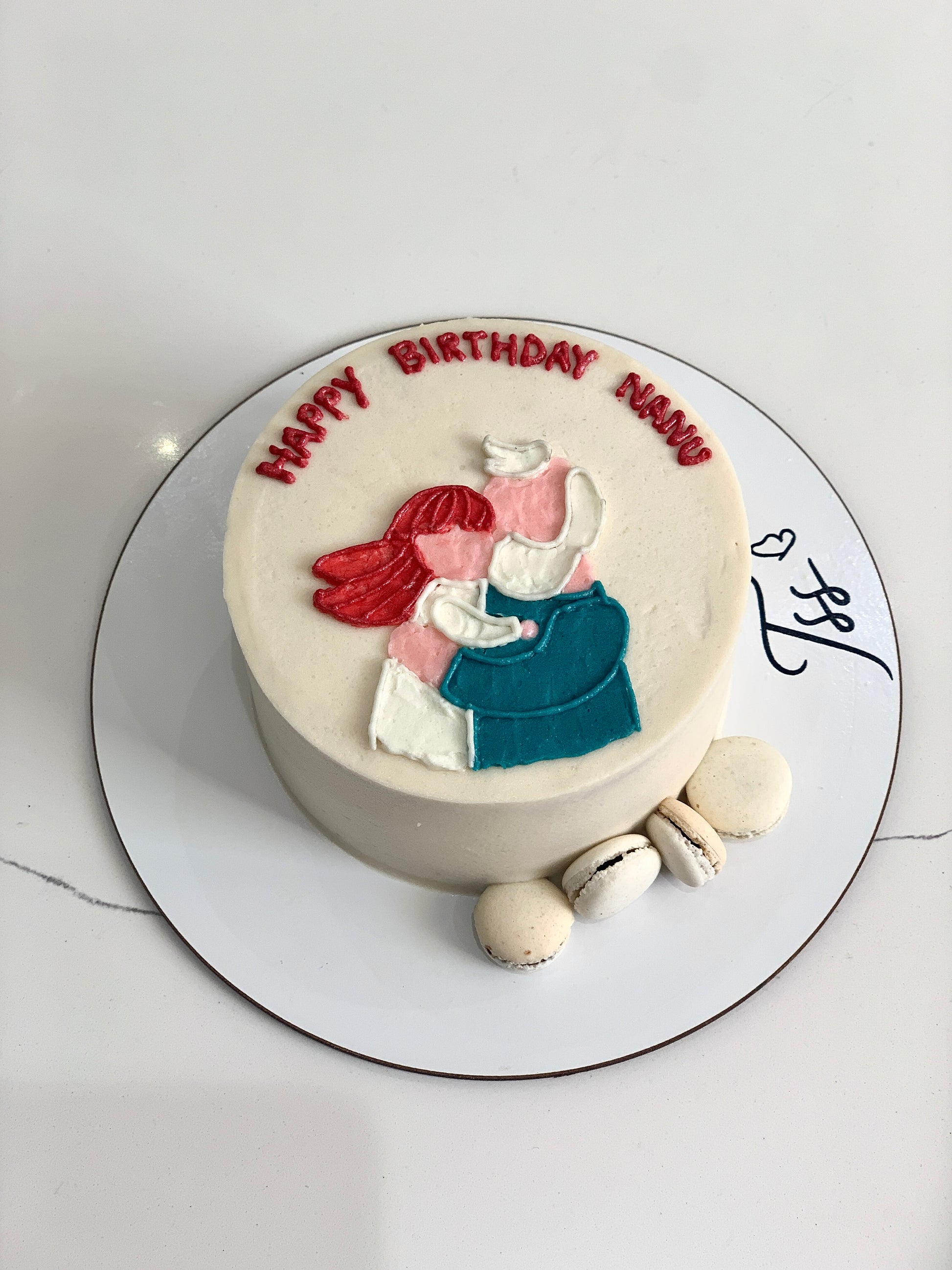 Colorful buttercream illustration cake by The Sinful Spoon with intricate floral and whimsical designs on smooth frosting surface.