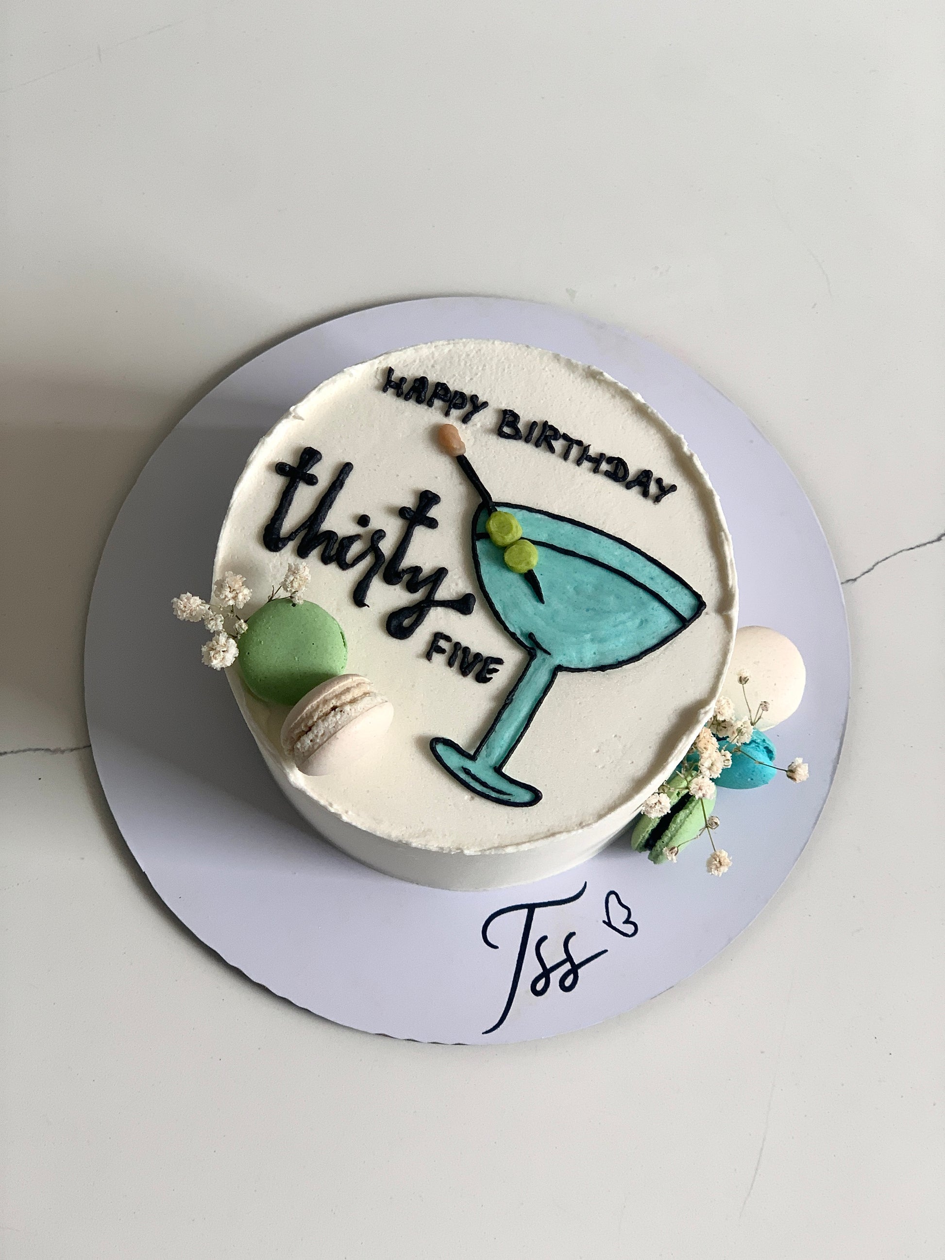 Buttercream illustration cake by The Sinful Spoon featuring colorful floral and whimsical designs on a layered cake.