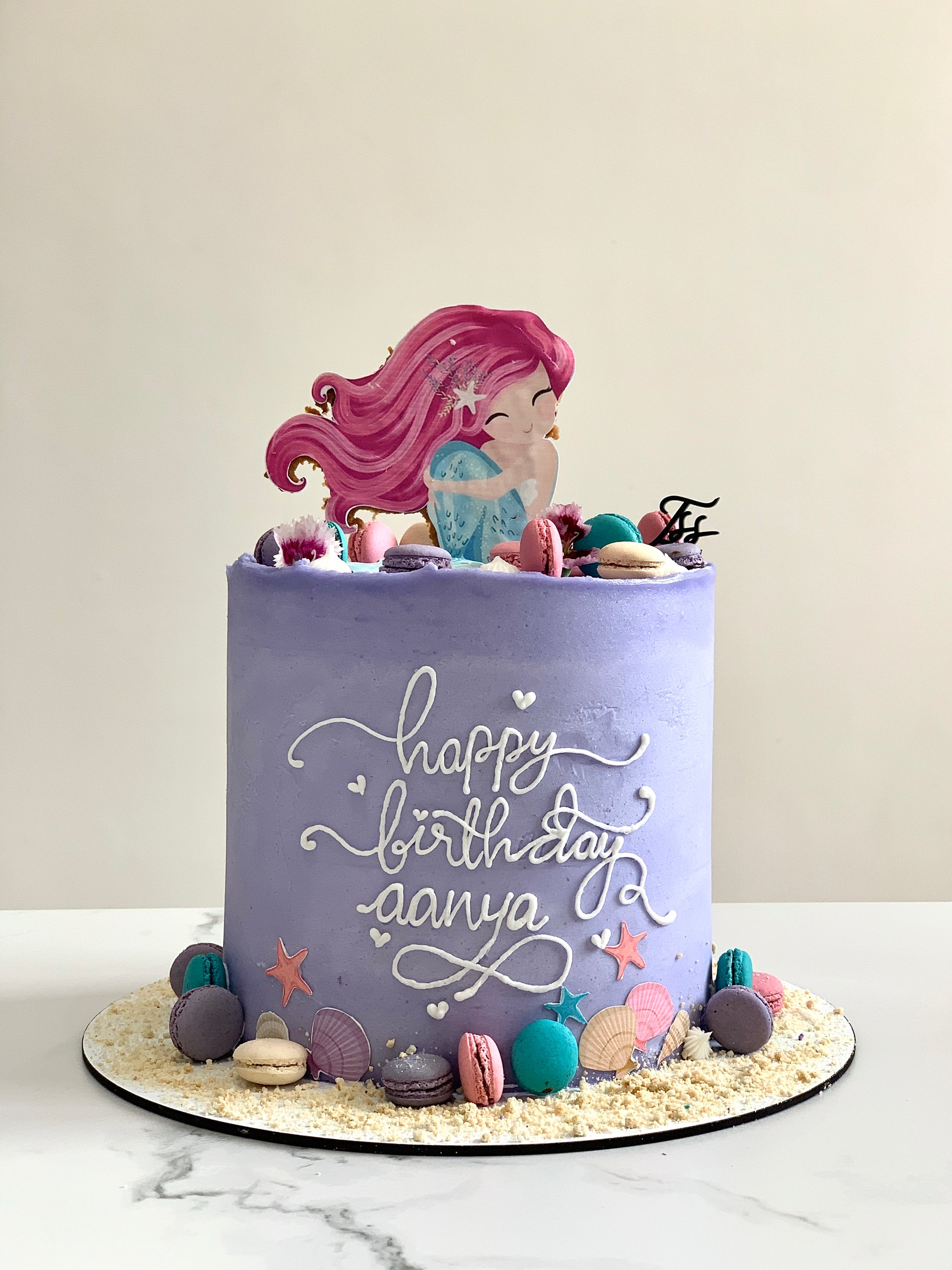 Edible paper cake topper featuring a baby girl design from The Sinful Spoon, perfect for baby showers and celebrations.