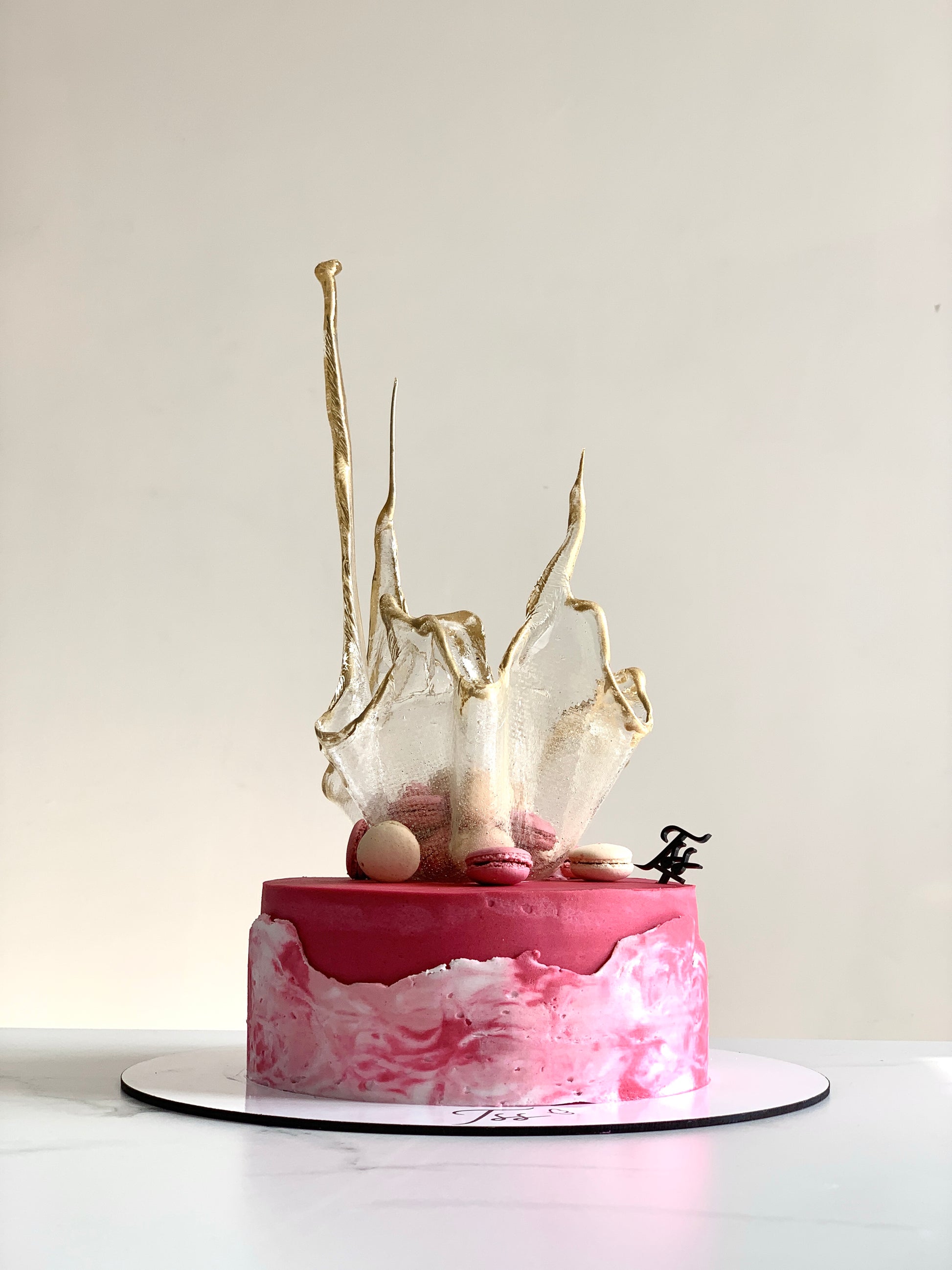 Isomalt cakes from The Sinful Spoon, colorful sugar art pieces suitable for cake decorating and confectionery projects.