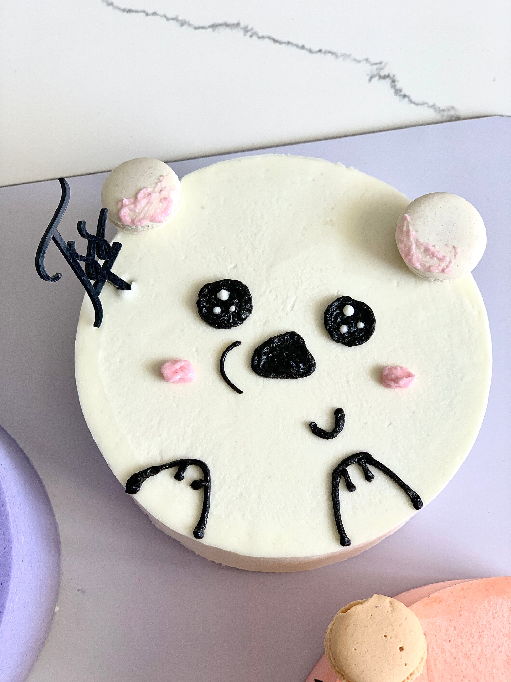 Decorative buttercream illustration cake by The Sinful Spoon featuring intricate floral and artistic piping details.