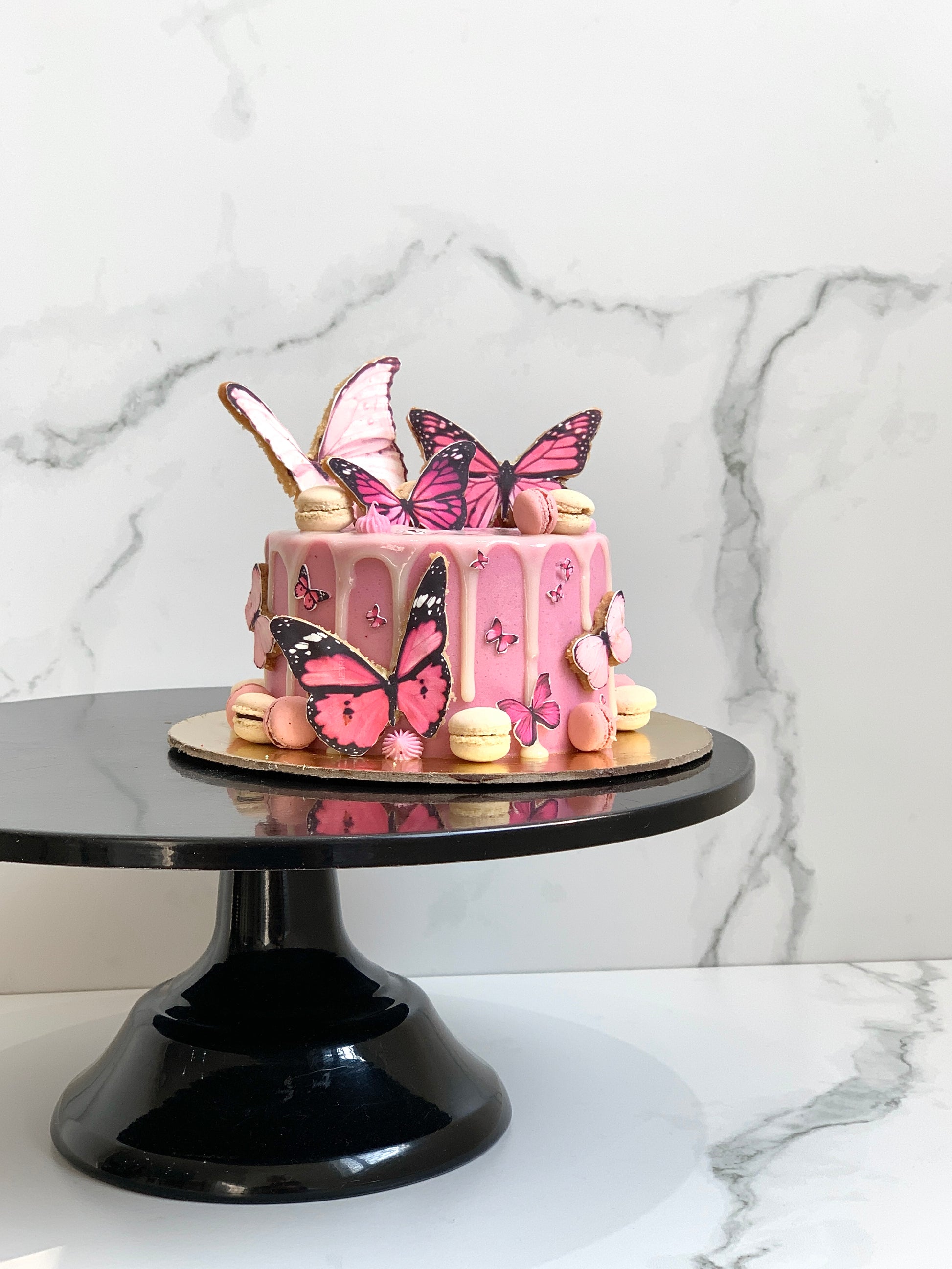 Edible paper cake topper featuring a baby girl design from The Sinful Spoon, perfect for baby shower celebrations.
