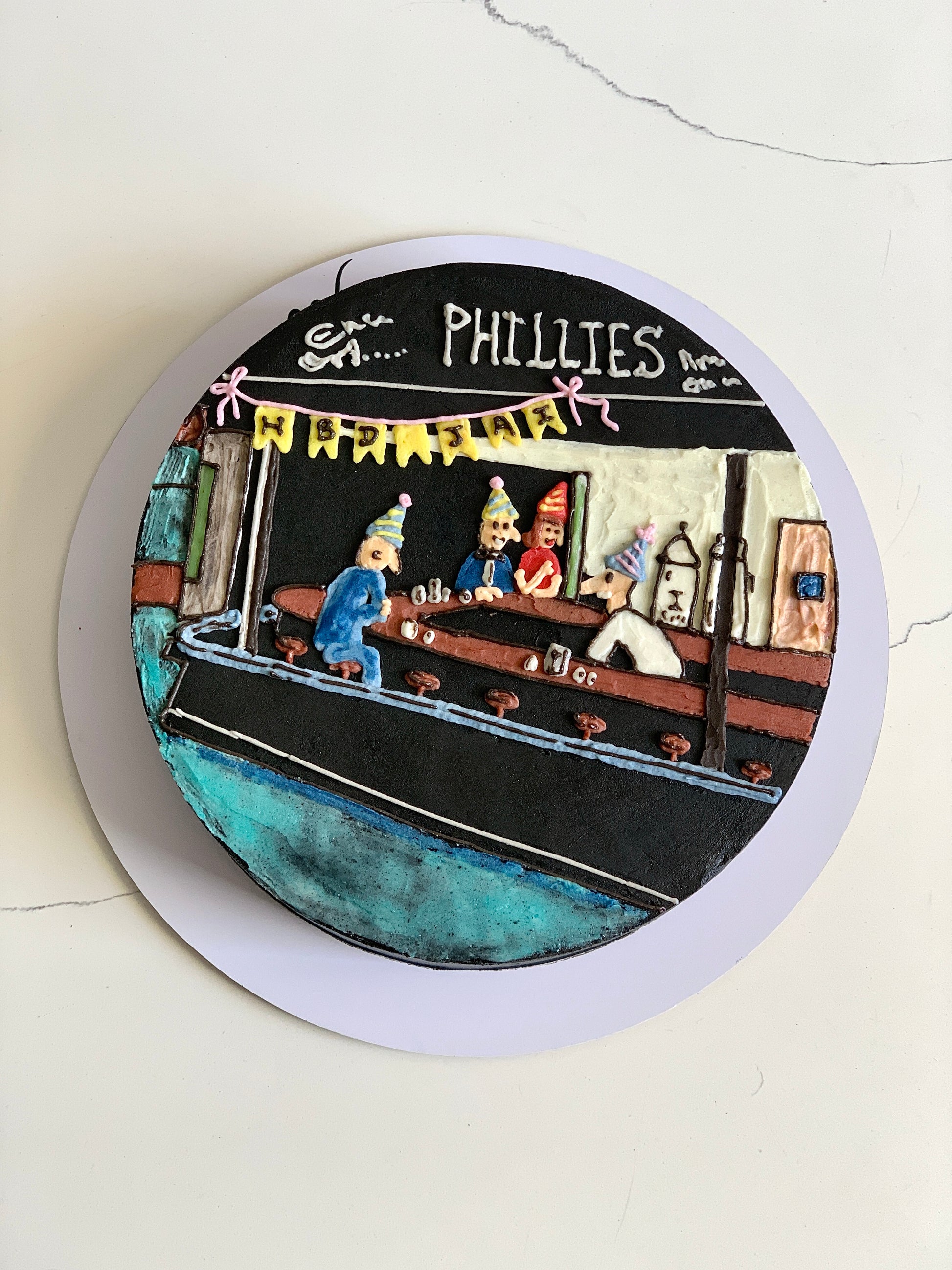 Colorful buttercream illustration cake by The Sinful Spoon with vibrant, detailed decorative frosting and artistic design.