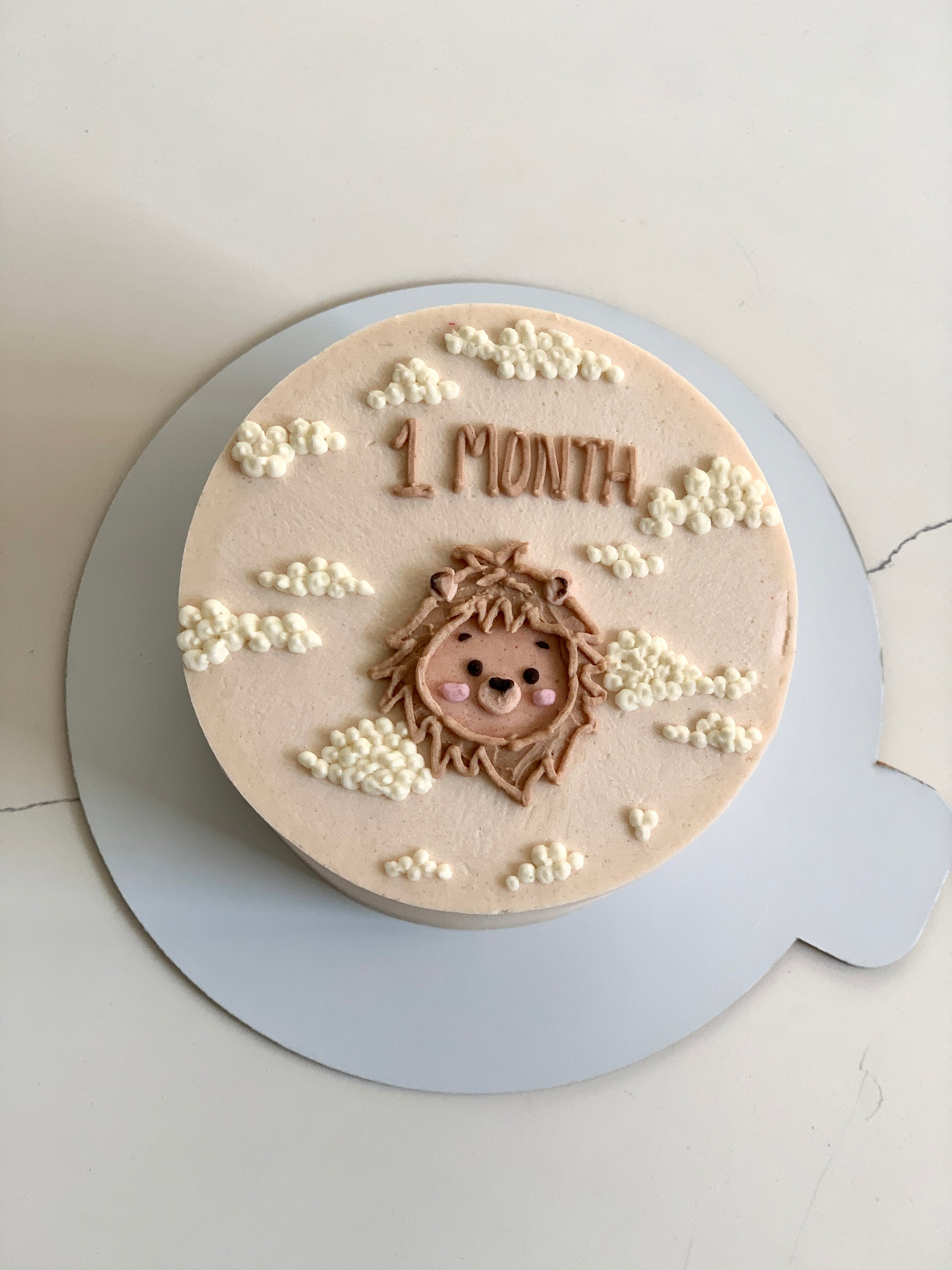 Decorative buttercream illustration cake by The Sinful Spoon with colorful floral and whimsical design on white frosting.