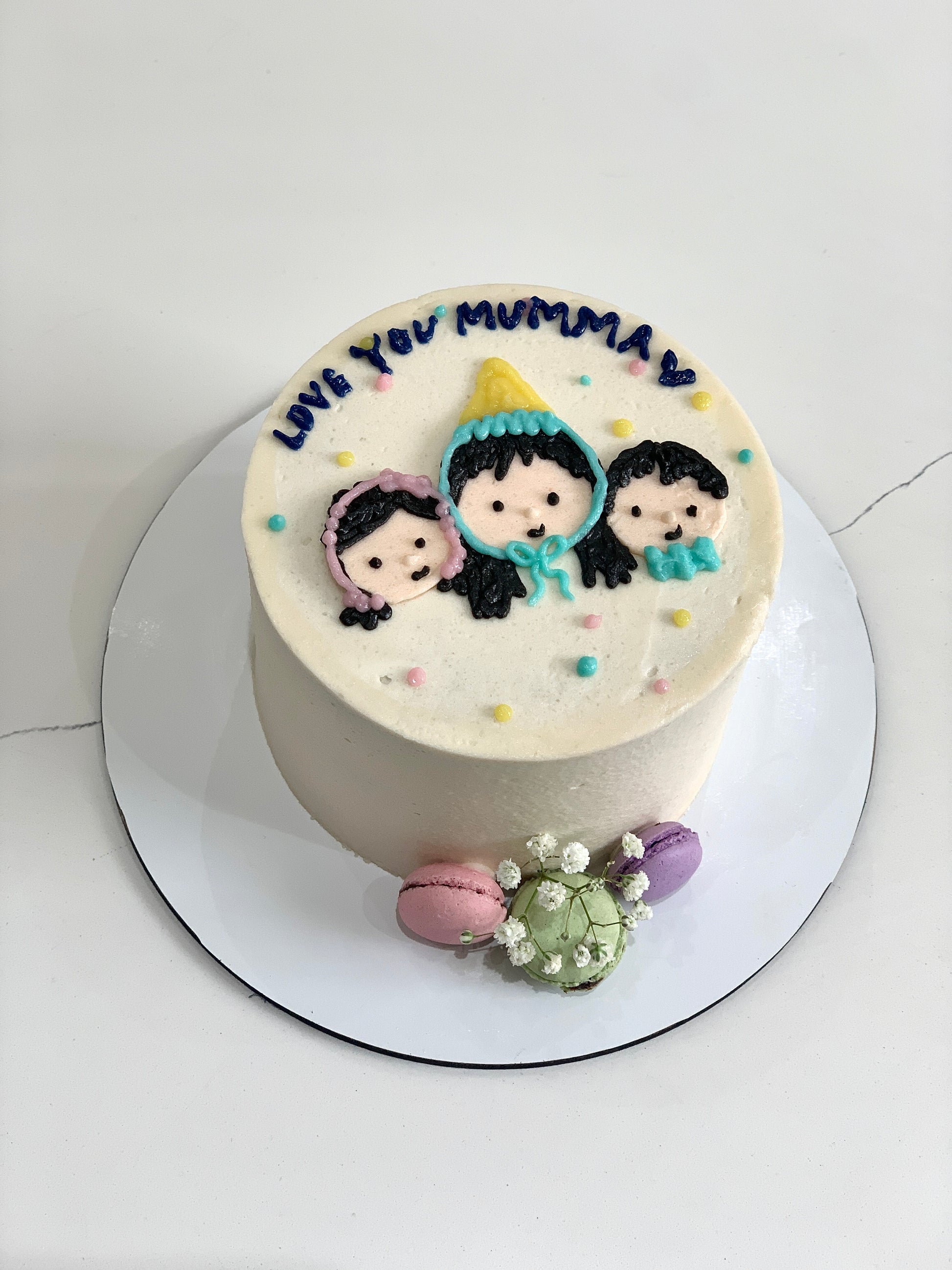 Colorful buttercream illustration cake by The Sinful Spoon with vibrant floral and whimsical designs on smooth fondant.