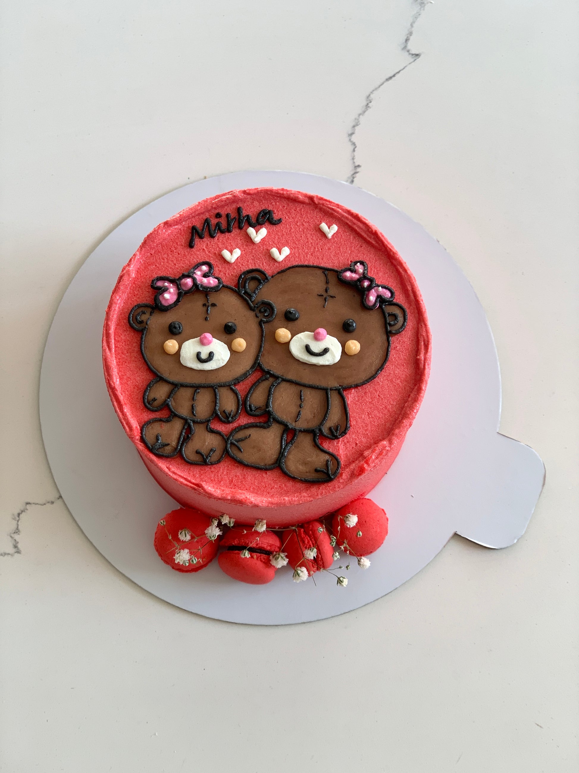 Decorative buttercream illustration cake by The Sinful Spoon with colorful floral and artistic piping details.
