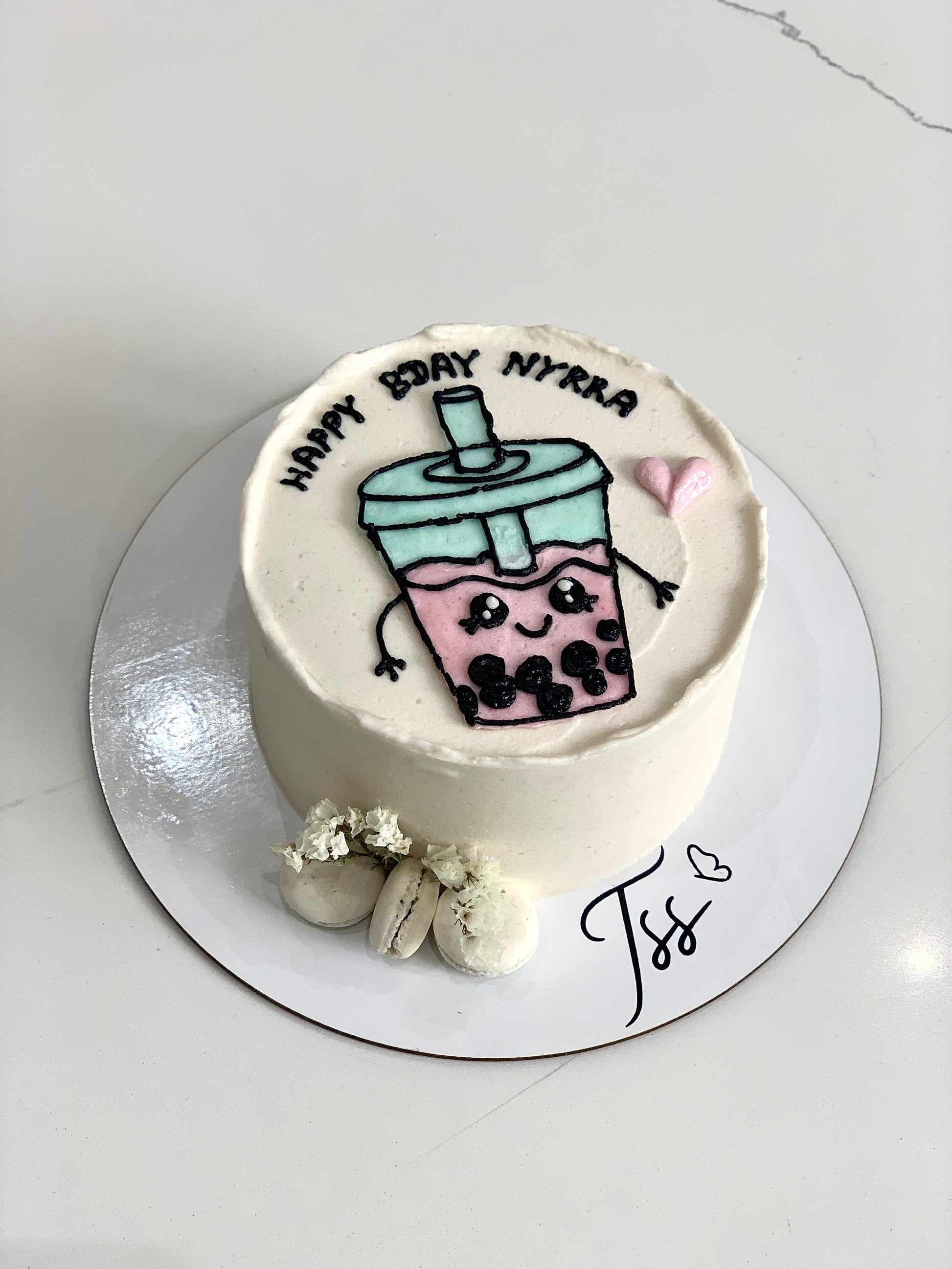 Colorful buttercream illustration cakes by The Sinful Spoon with detailed piped floral designs on a white background.