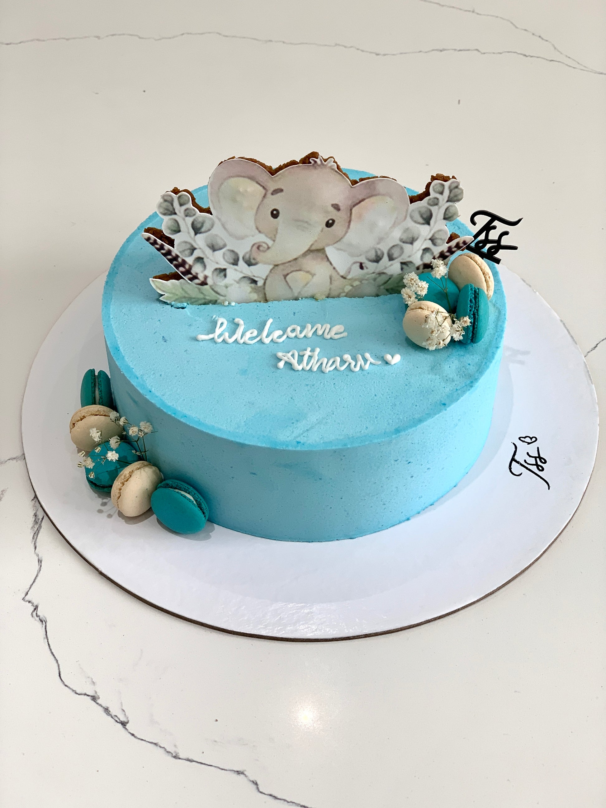 Edible paper cake with baby boy design from The Sinful Spoon, decorated for a special celebration or baby shower.