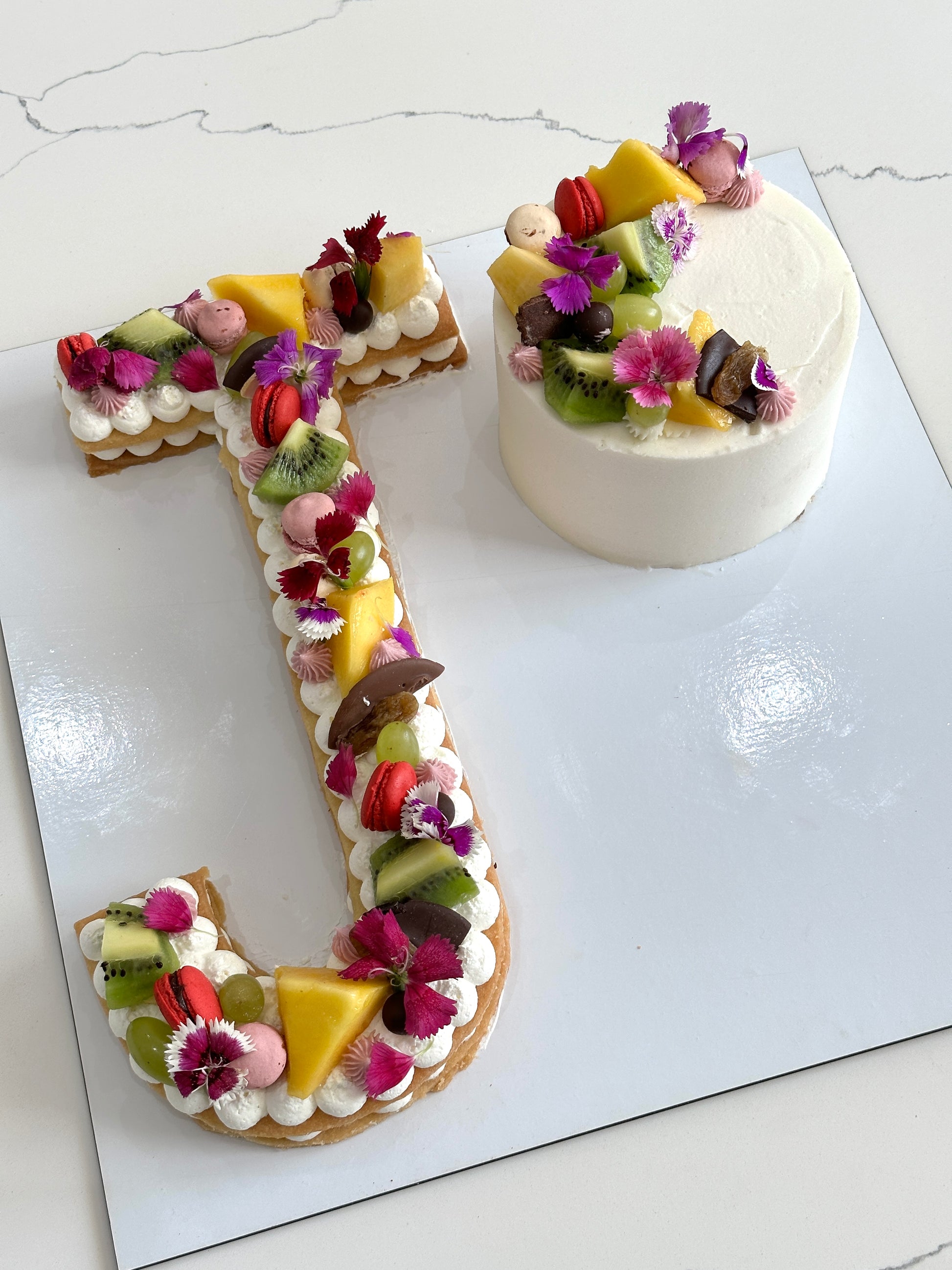 Assorted combo cakes from The Sinful Spoon displayed on a plate, showcasing various flavors and rich textures.