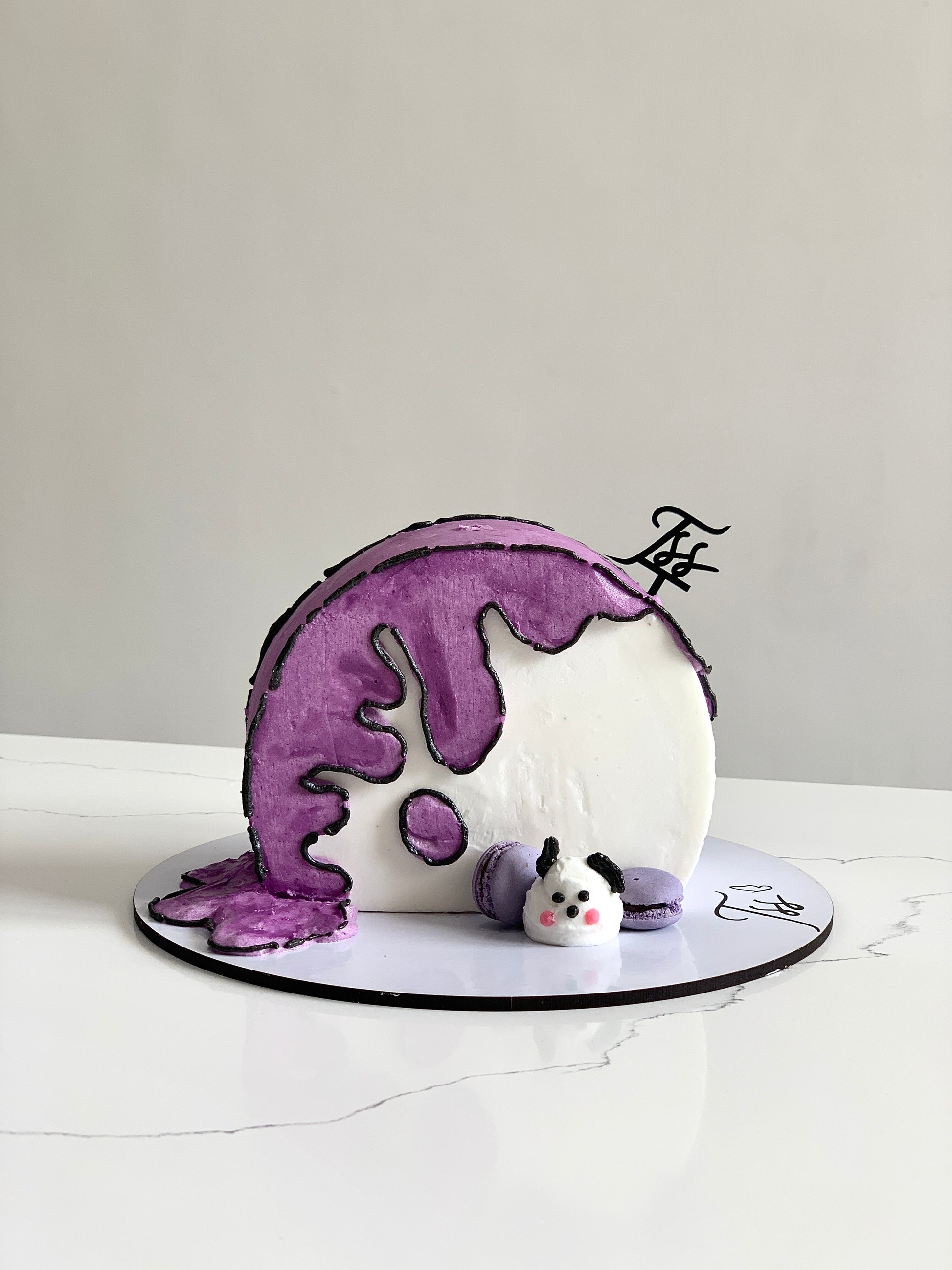 Colorful comic cake with vibrant icing and detailed character designs, created by The Sinful Spoon.