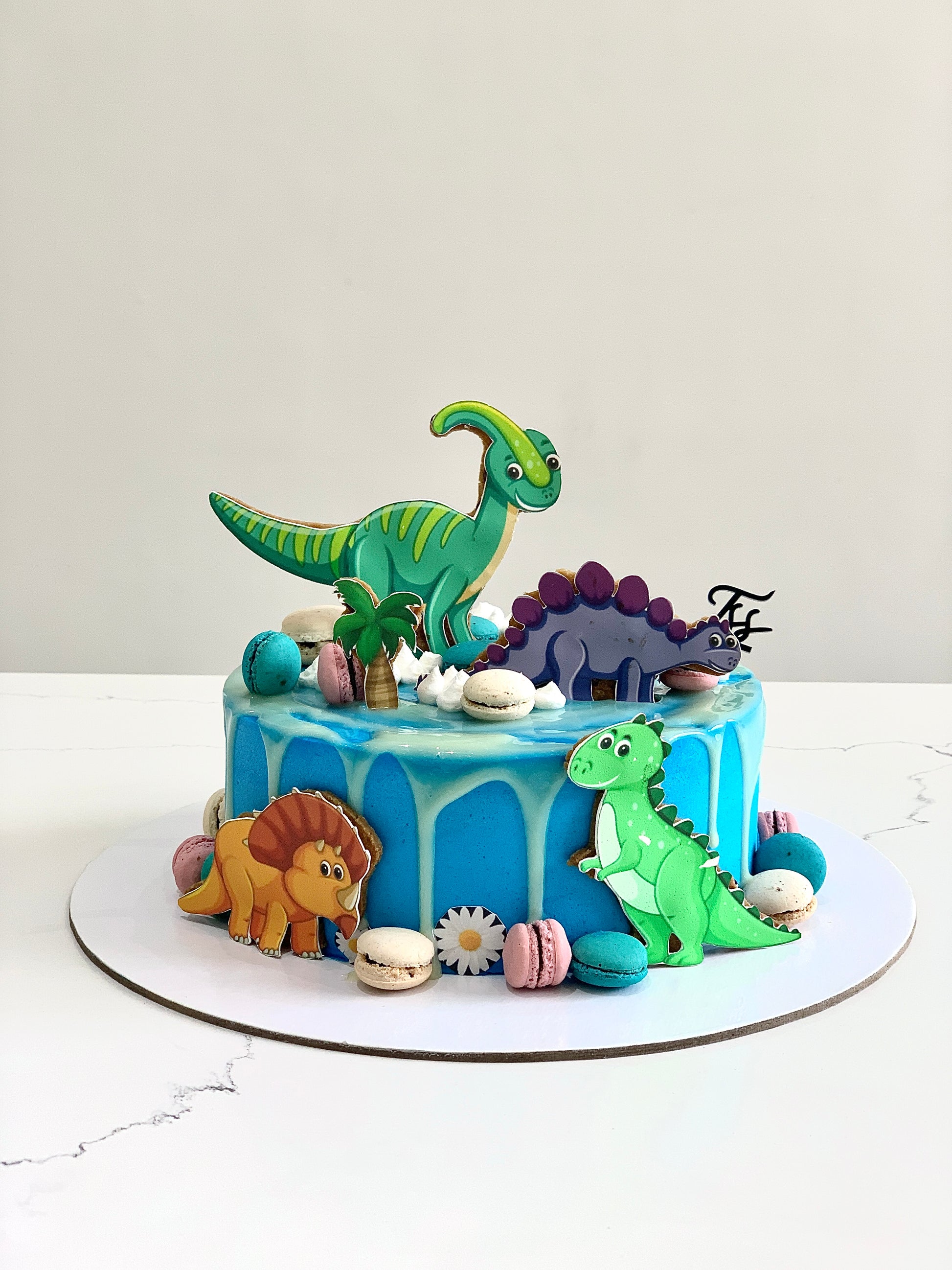 Edible paper cake topper featuring a baby boy design from The Sinful Spoon, ideal for baby shower or birthday cakes.