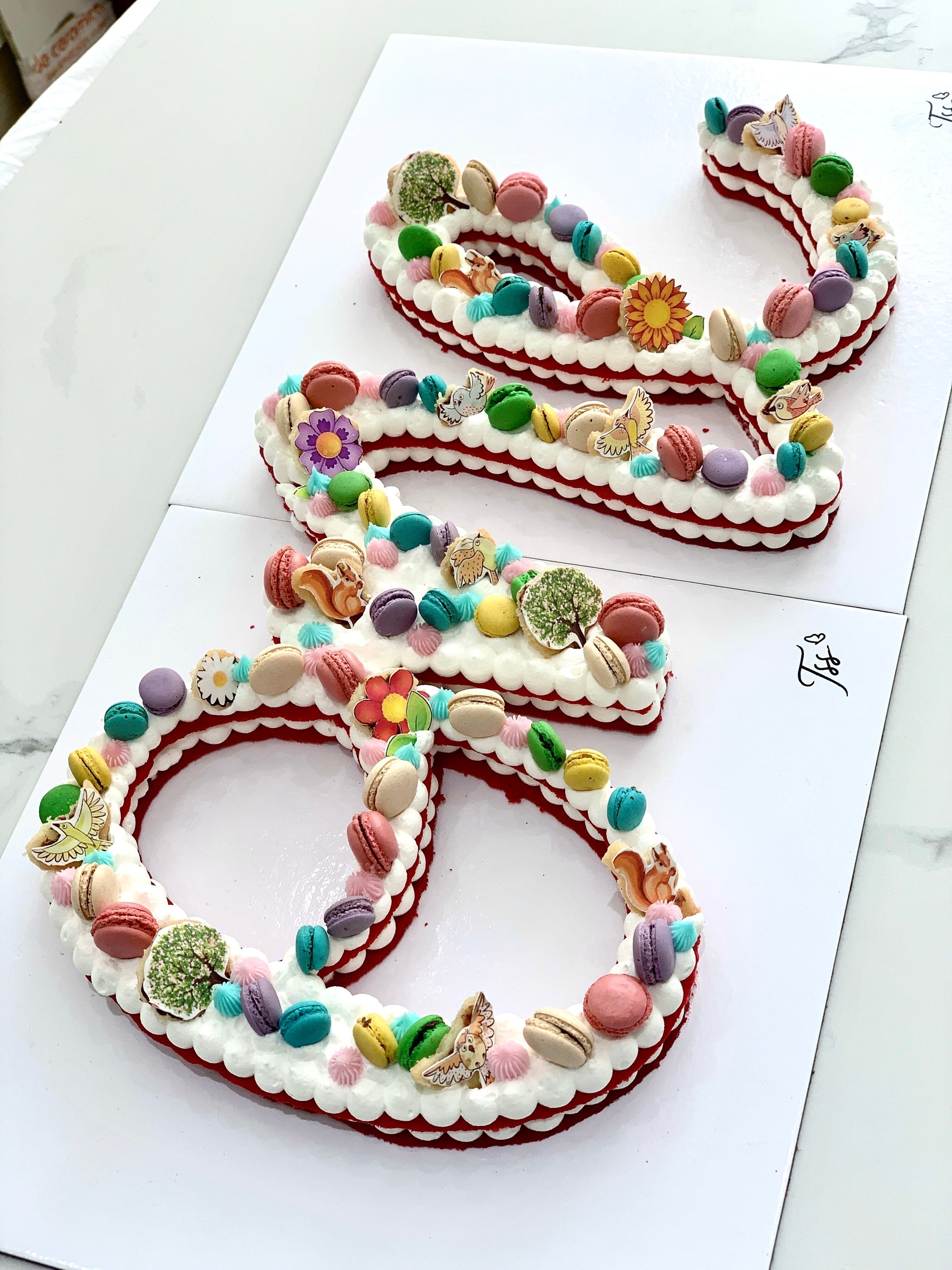 Chocolate chip cookie cake from The Sinful Spoon with colorful sprinkles and a festive design on top.