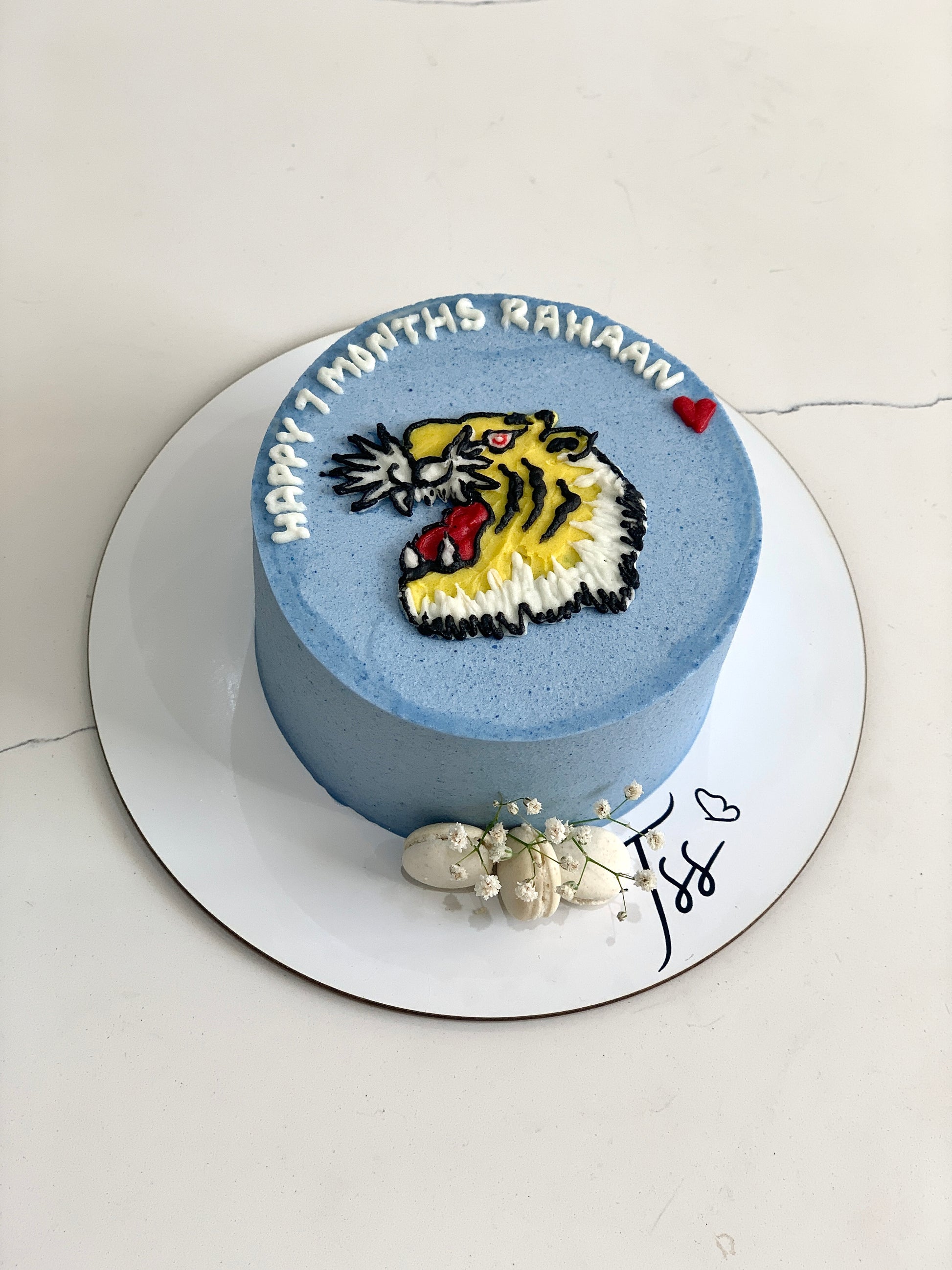 Colorful buttercream illustration cake by The Sinful Spoon with detailed floral and artistic piping decorations.