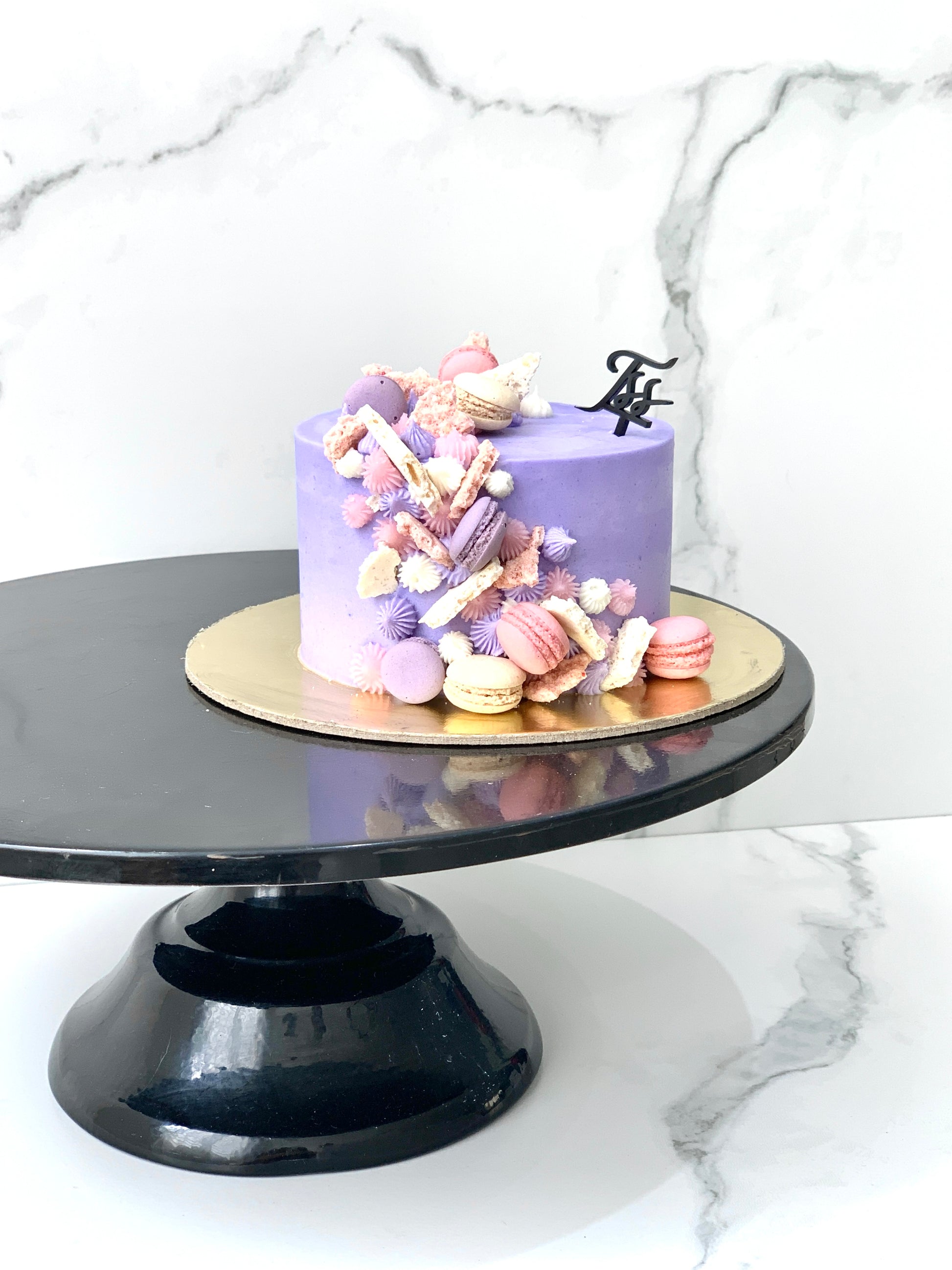 Delicious classic cakes from The Sinful Spoon displayed on a plate, showcasing their rich textures and appealing appearance.
