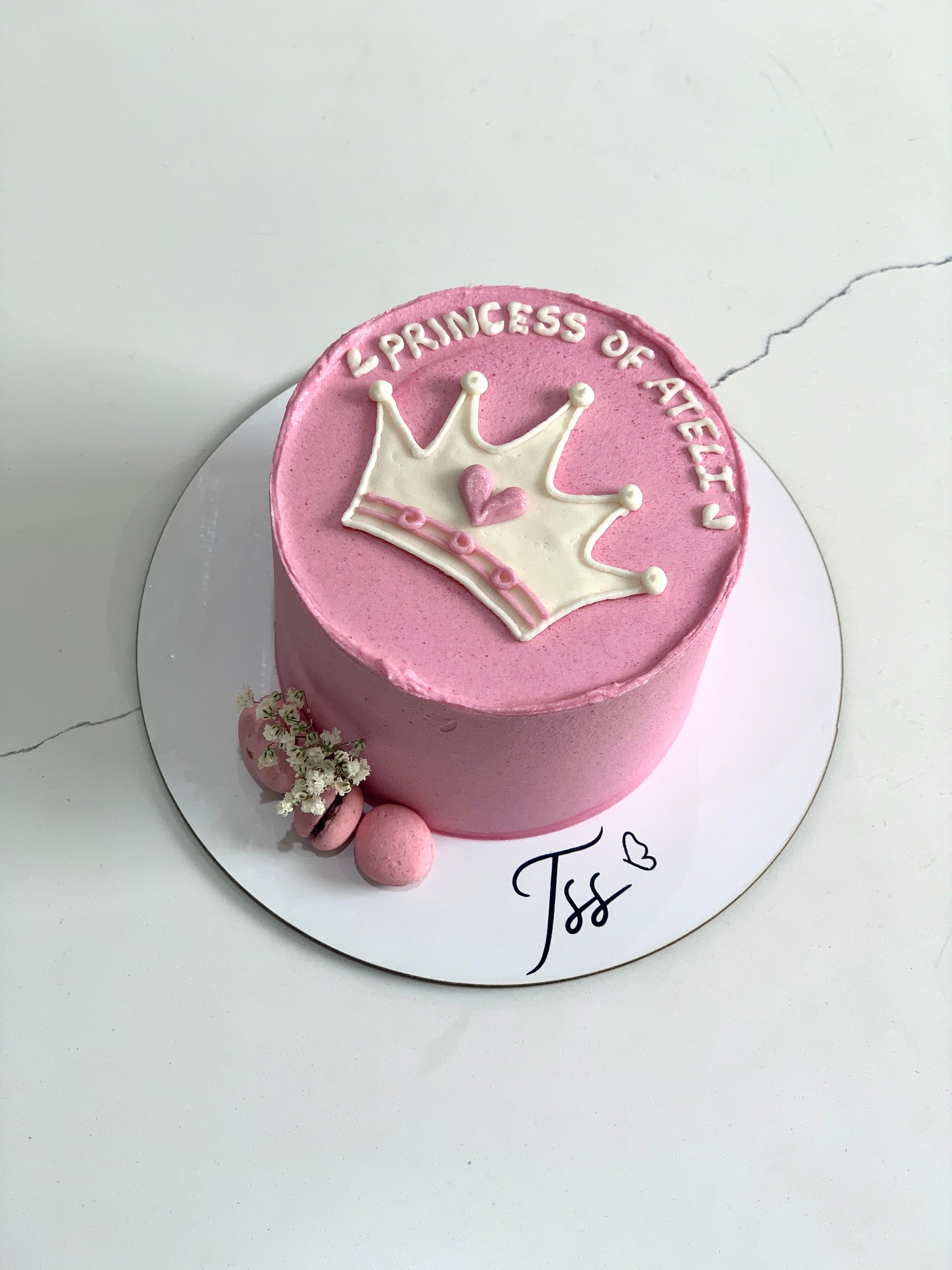 Decorative buttercream illustration cake by The Sinful Spoon featuring colorful, artistic piping and detailed floral designs.