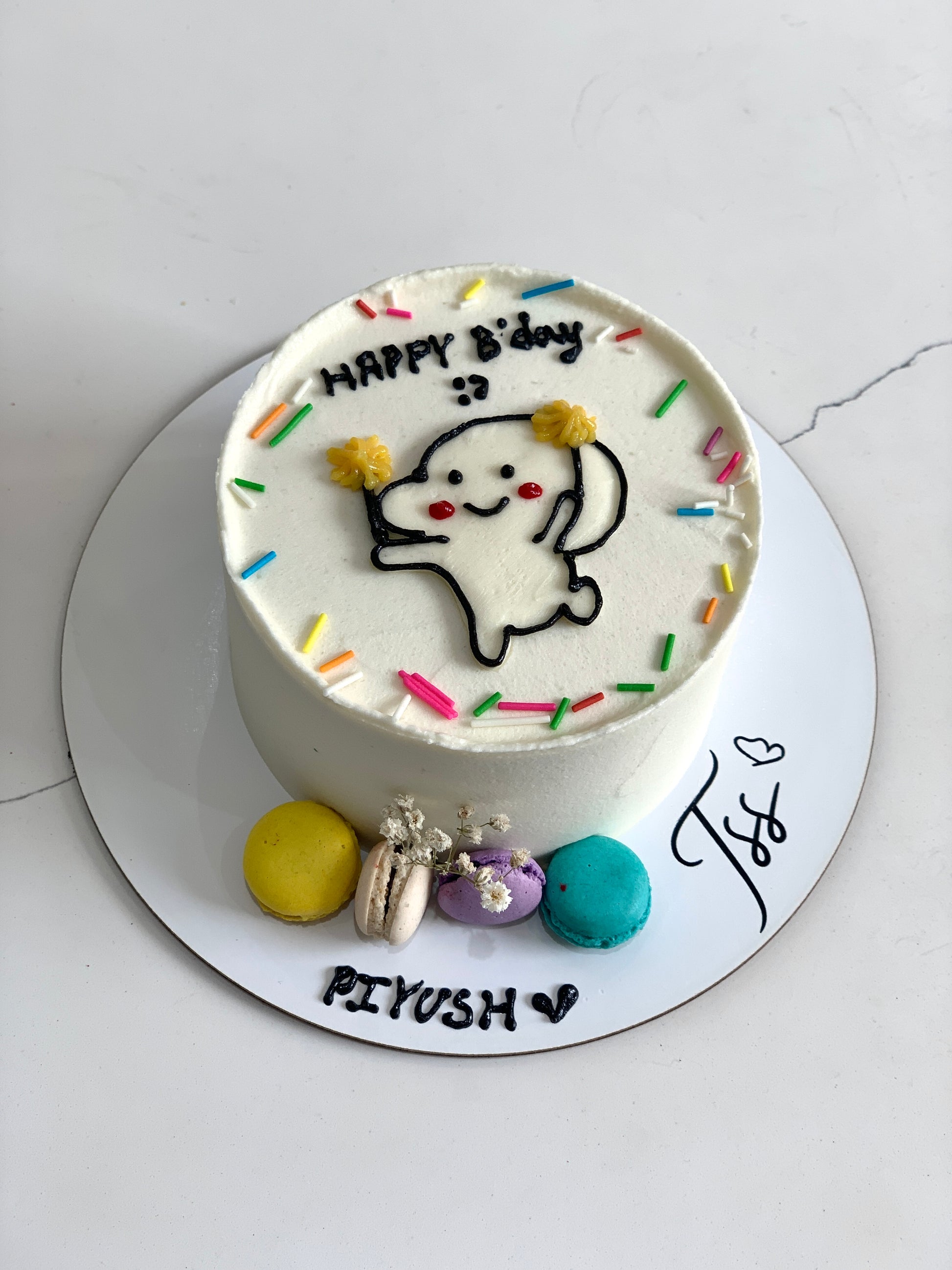 Buttercream illustration cake by The Sinful Spoon featuring colorful floral and whimsical design on a smooth cake surface.
