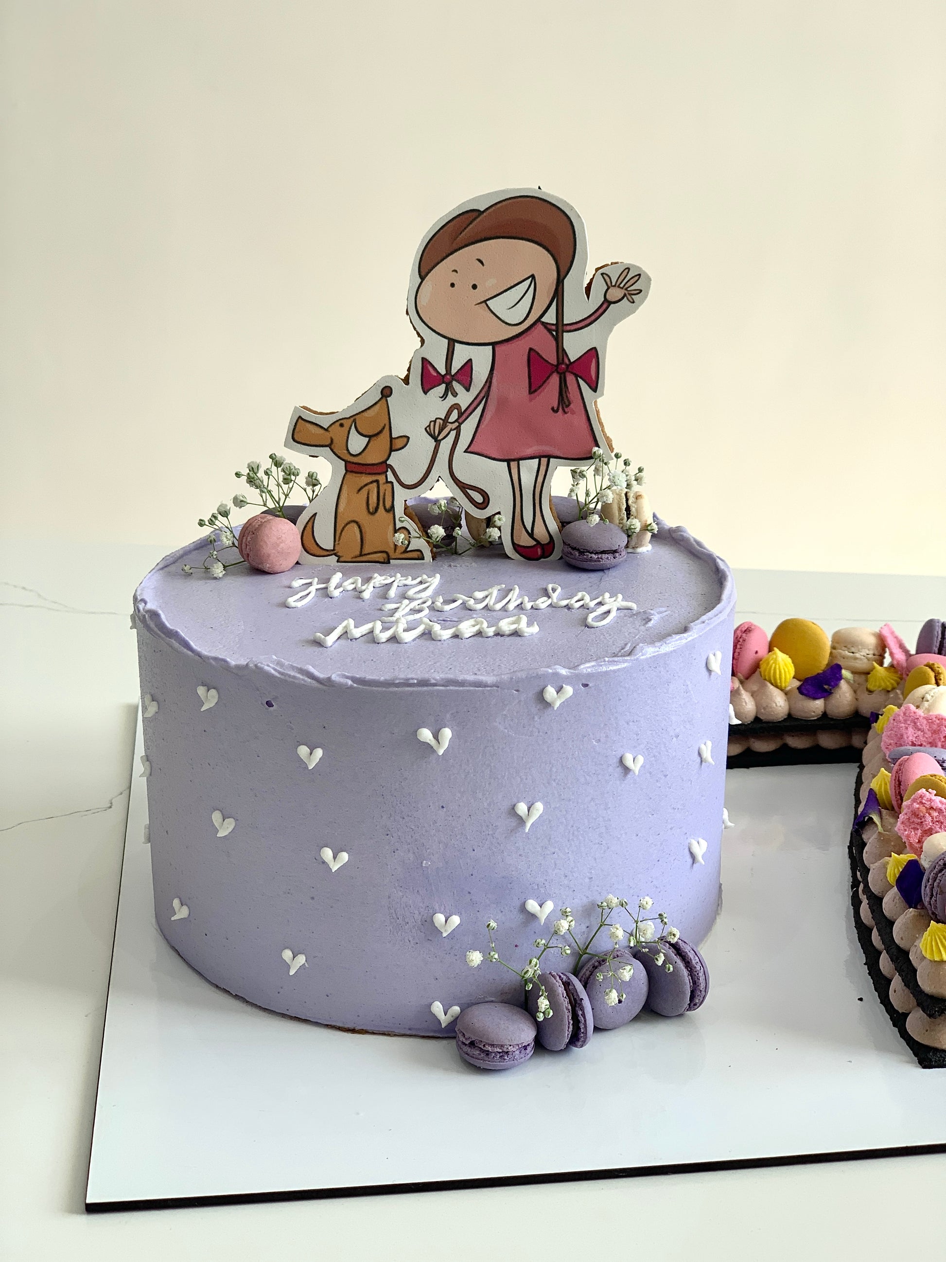 Edible paper cake topper featuring a baby girl design from The Sinful Spoon, perfect for baby shower celebrations.